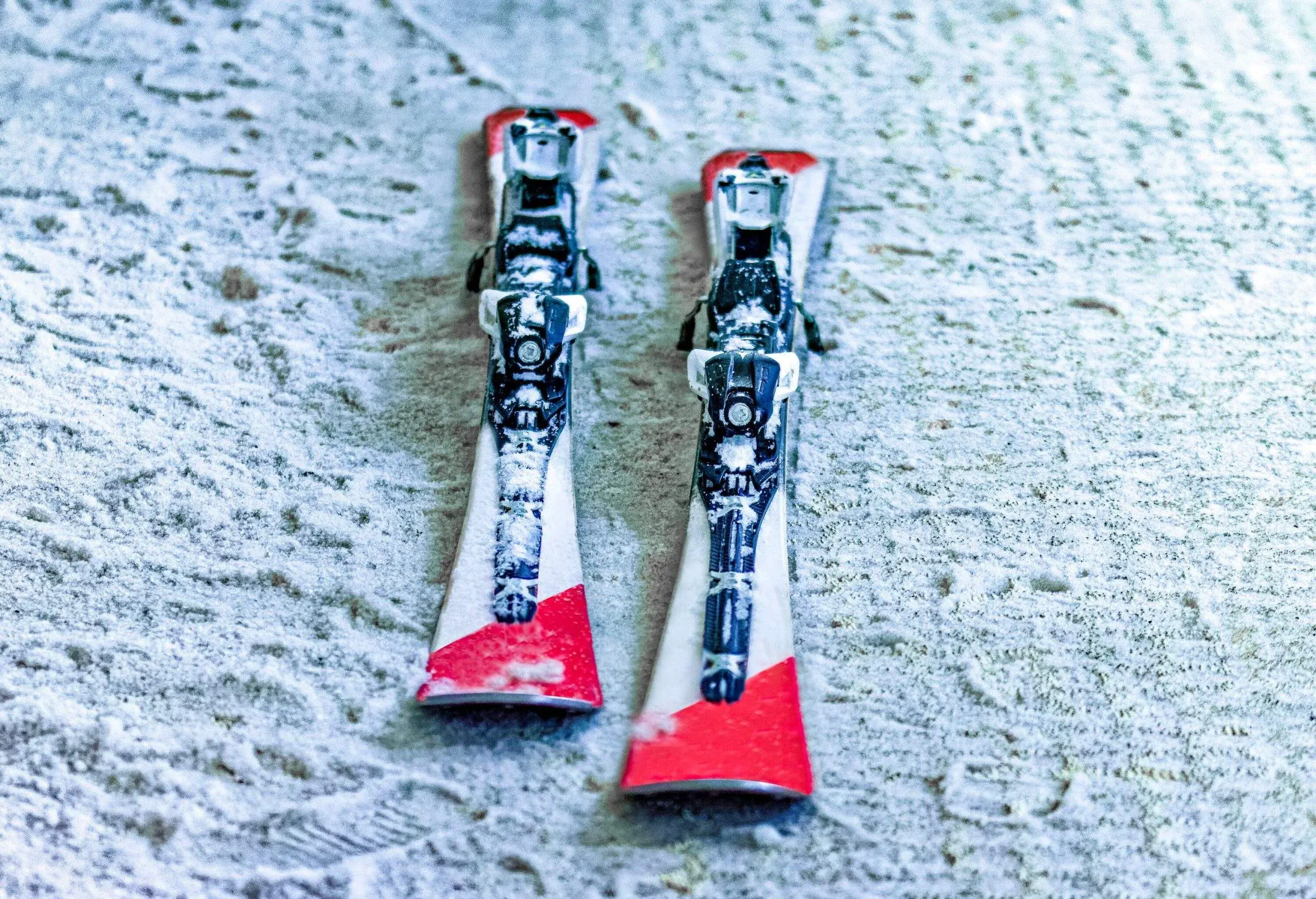 Two skis lying on the snowy ground