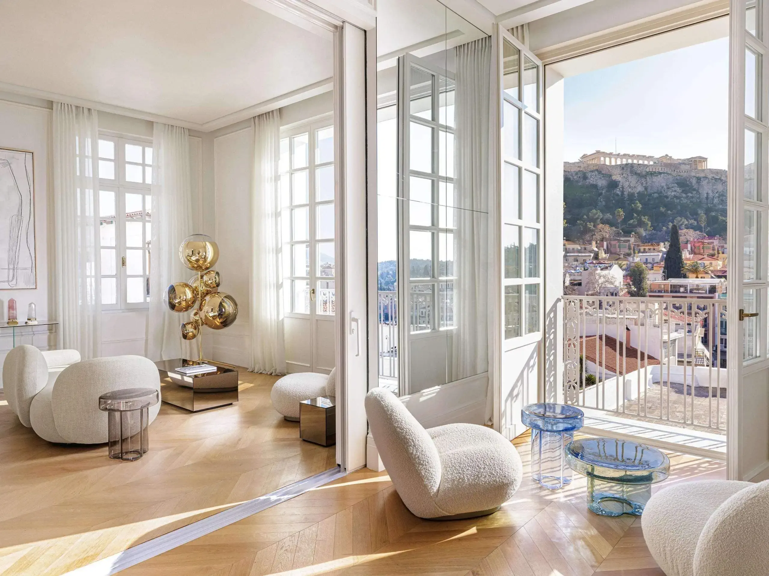 Luxury modern hotel room with contemporary furniture overlooking ancient European city