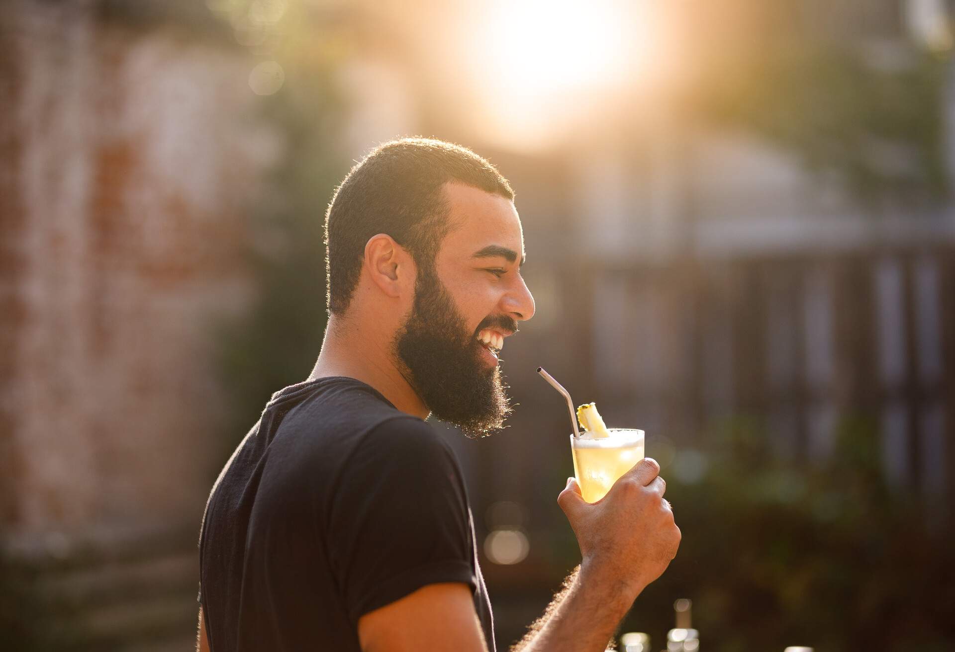 THEME_PEOPLE_MAN_ROOFTOP_COCKTAIL_DRINK_GettyImages-1158066969