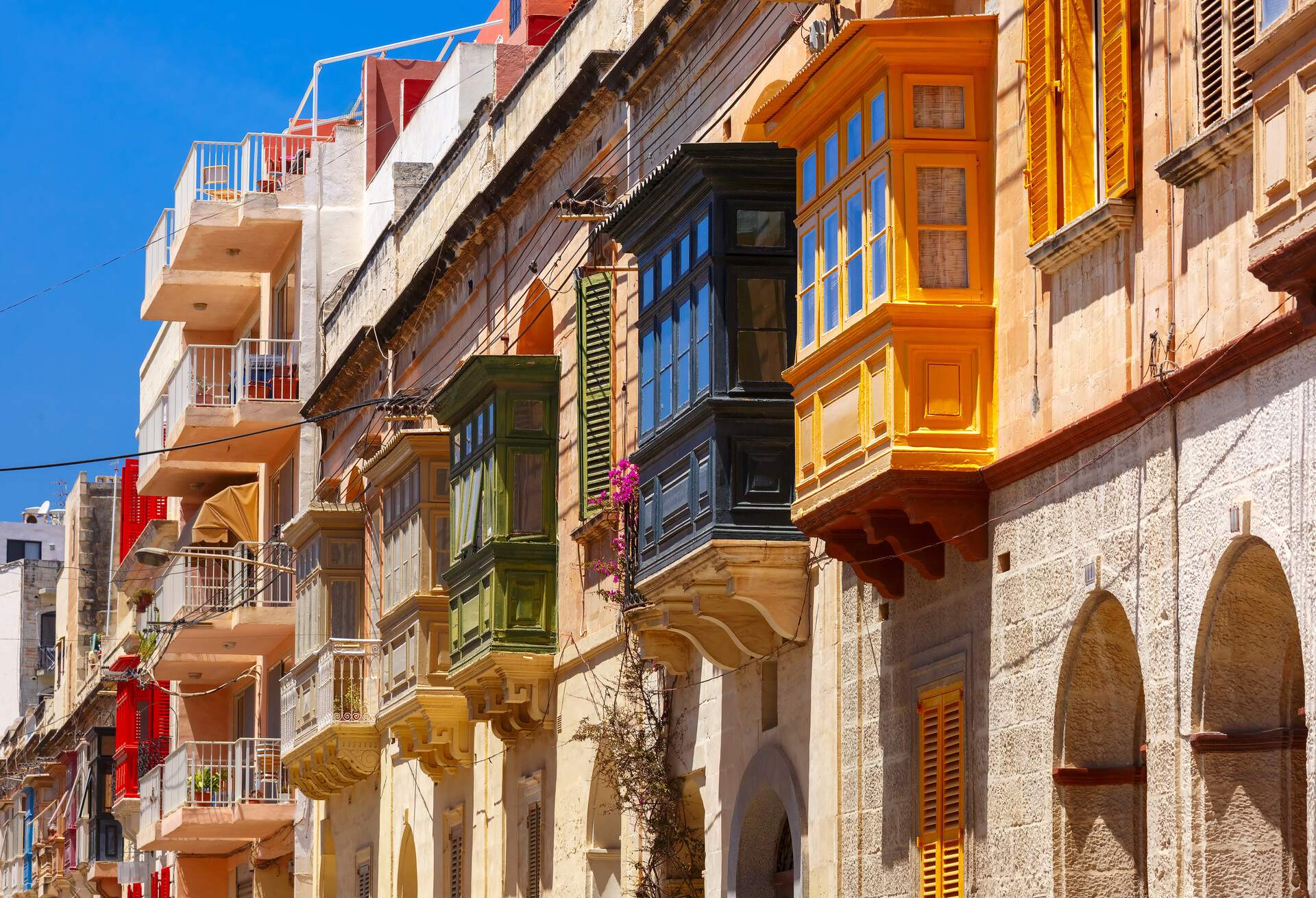 The traditional Maltese colorful wooden balconies in Sliema, Malta; Shutterstock ID 648798856