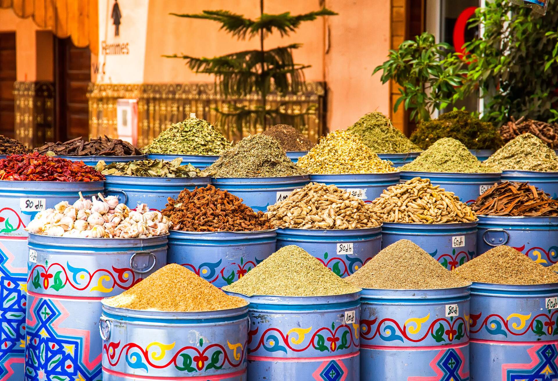 Traditional dried spices on colourful bins.