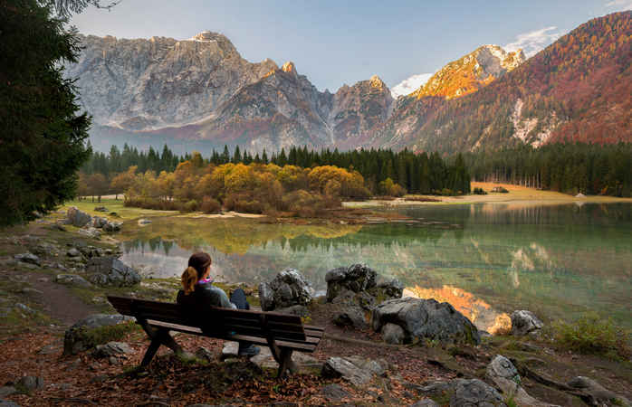 Young female is enjoying autumn colors at Laghi di Fusine  in Italy; Shutterstock ID 776290393