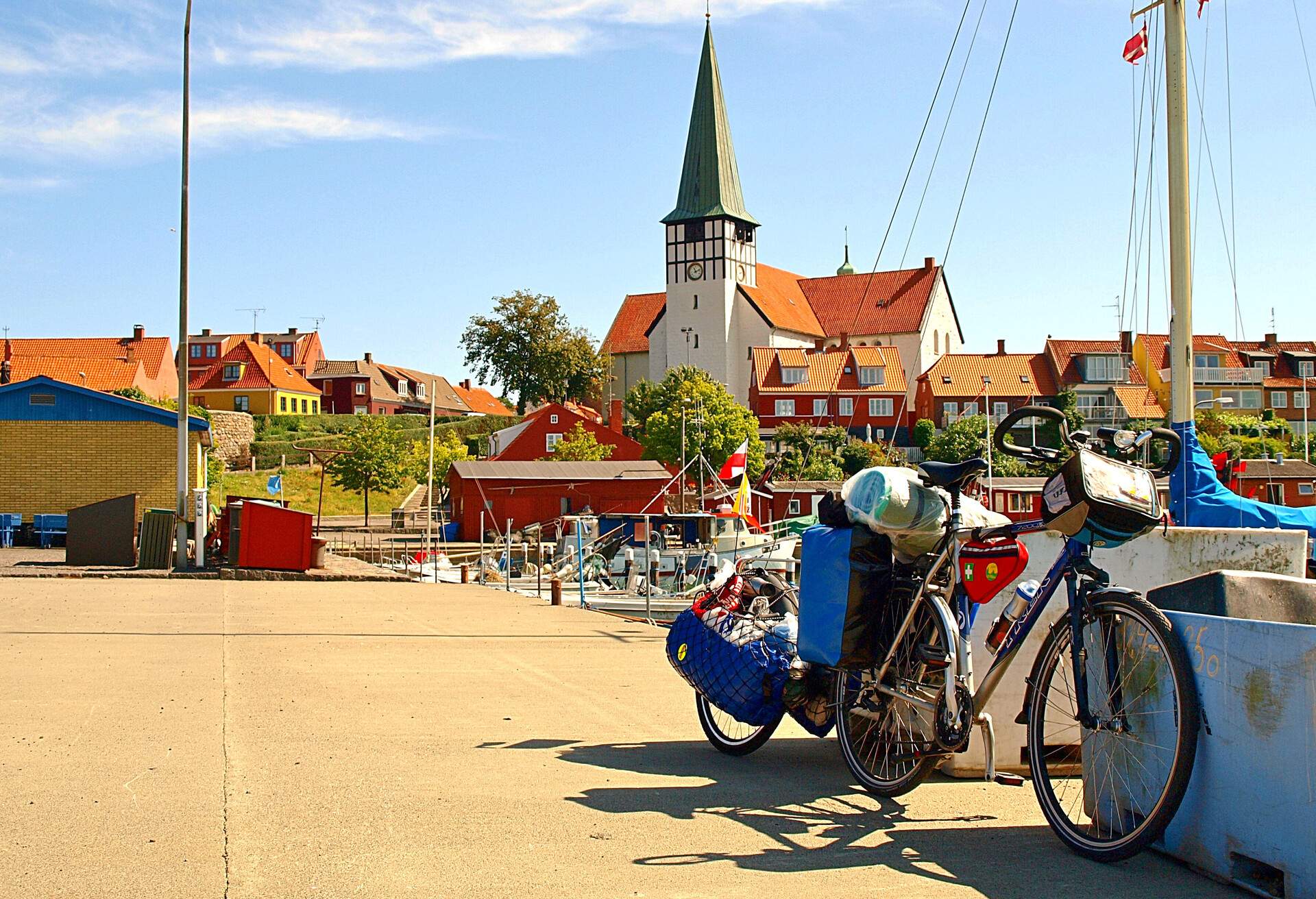 Bicycle in the port of Ronne..Ronne, Denmark - July 31, 2010.My bike with a trailer in sweat Ronne during a cycling trip to the Danish island of Bornholm.; Shutterstock ID 531517222; Purpose: Blogs; Brand (KAYAK, Momondo, Any): Any