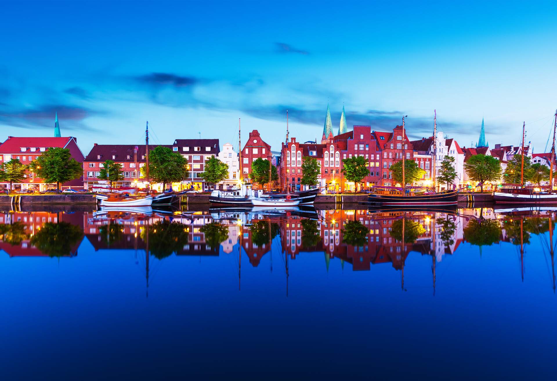 Scenic summer evening panorama view of the Old Town pier architecture in Lubeck, Germany; Shutterstock ID 1168888186; Purpose: ; Brand (KAYAK, Momondo, Any):