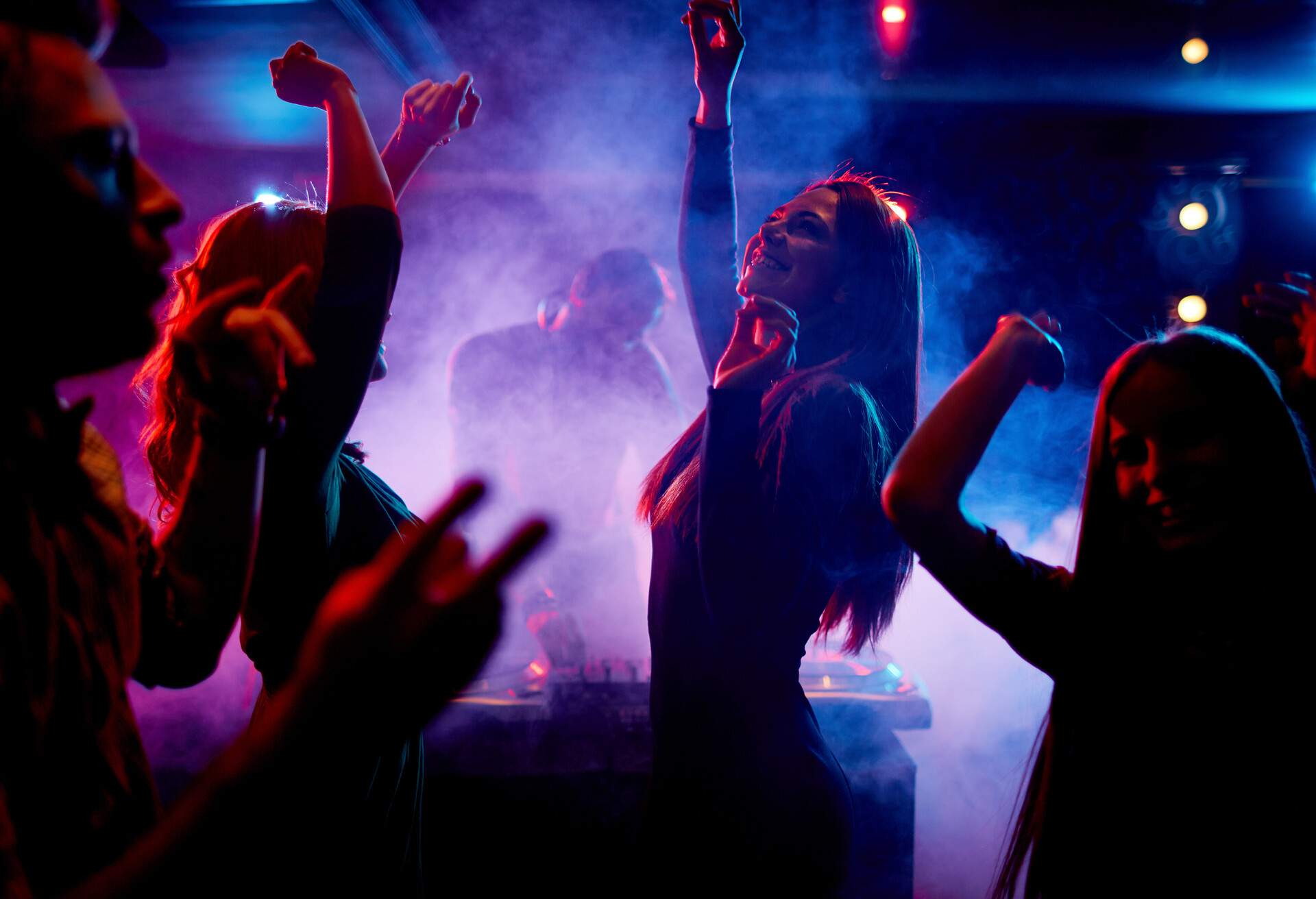 Group of dancing young people enjoying night in club; Shutterstock ID 247679890