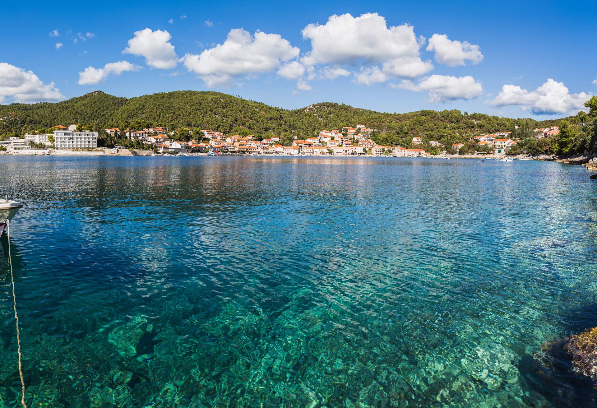A multiple image panorama looking across the aqua coloured waters of Brna Bay in Smokvica region of Korcula Island located on the southern slopes.