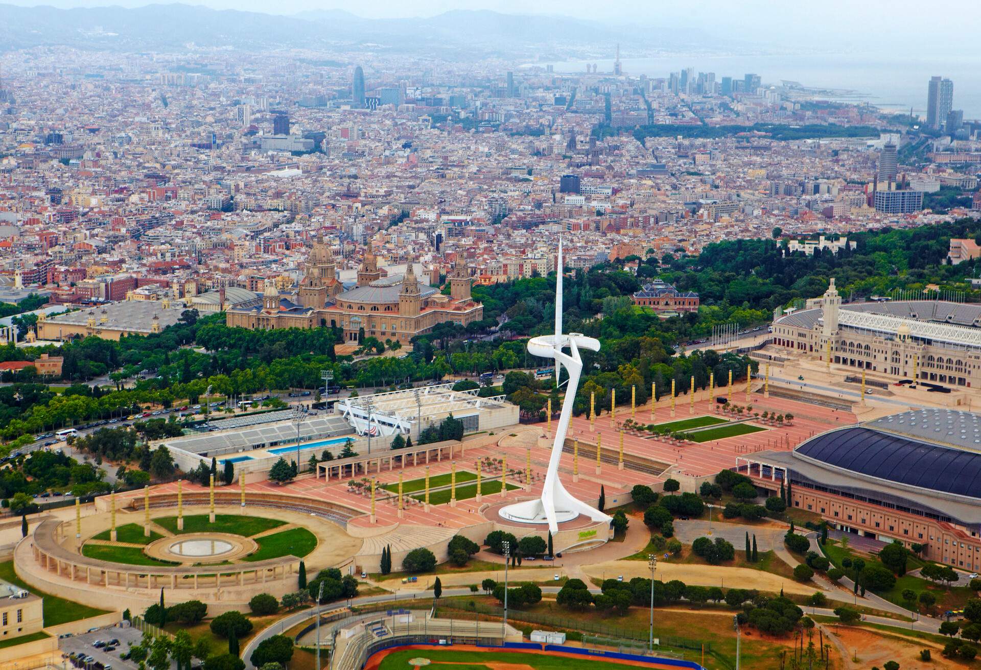 Ariel view from helicopter of Montjuic and skyline of Barcelona