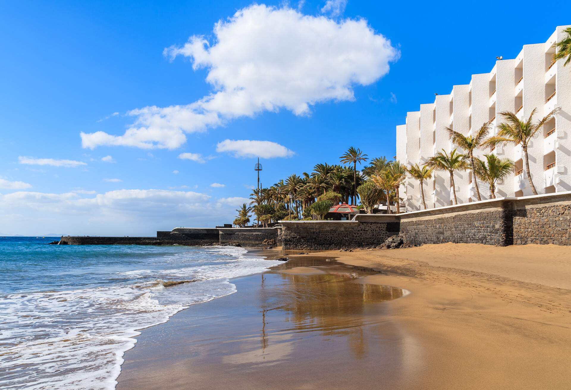 Ocean wave of sandy tropical beach in Puerto del Carmen, Lanzarote, Canary Islands, Spain; Shutterstock ID 246026494