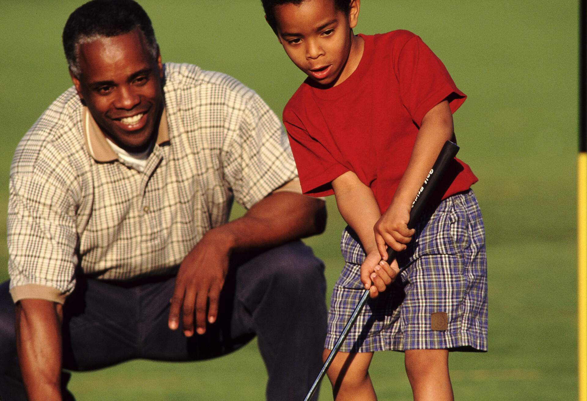 theme_people_black_family_golfer_gettyimages