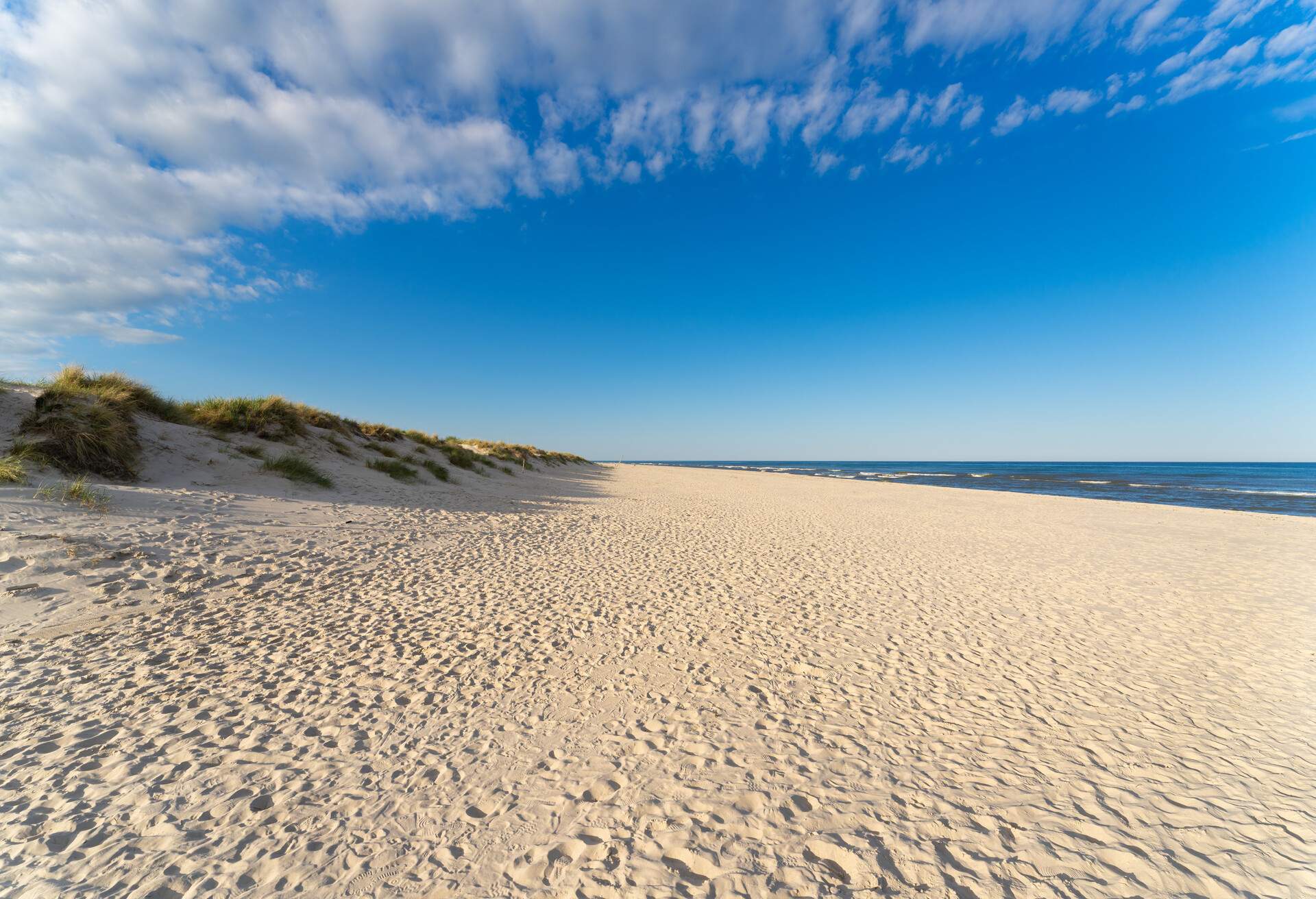 Amazing white sand beach in Sandhammaren, Sweden. Popular tourist destination in summer season.
