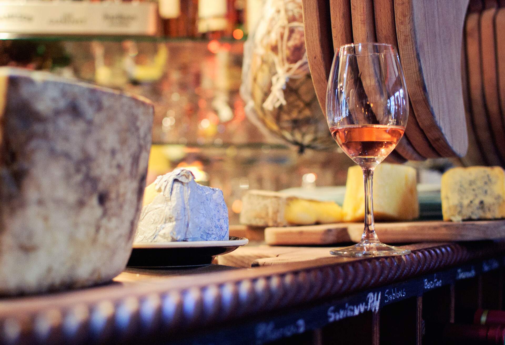 Wine and cheese on counter of cafe in Paris, France.