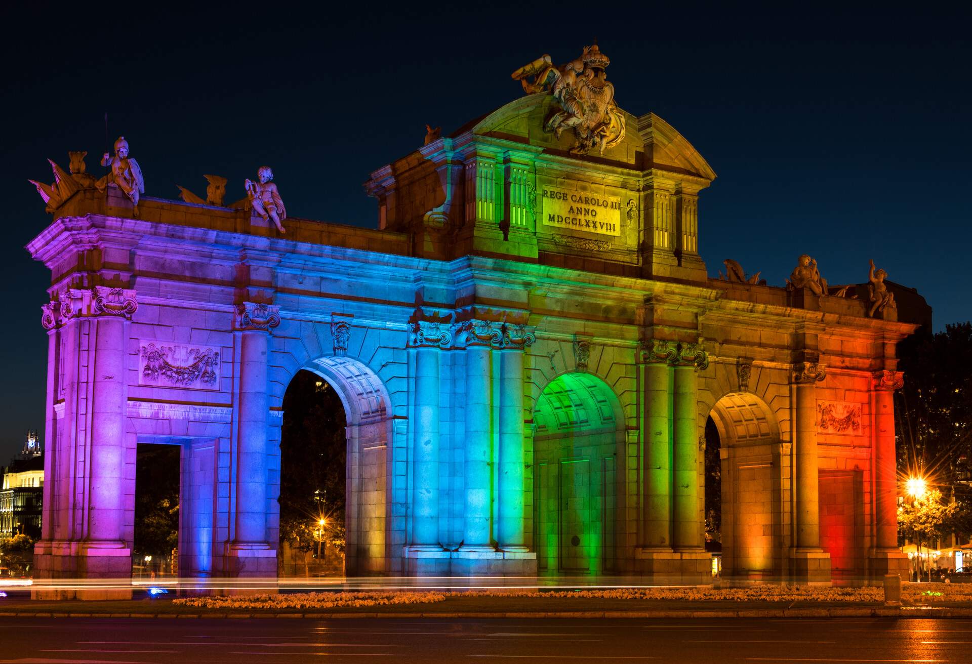 Alcala Gate (Puerta de Alcalá) in Madrid Celebrating World Pride Week Illuminated in Rainbow Colours; Shutterstock ID 665453242