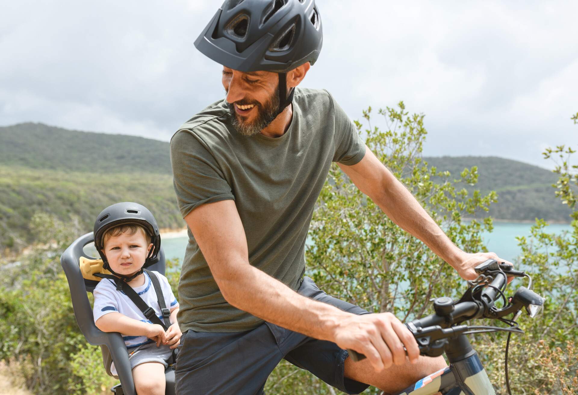 Family with toddler using e-bike in Tuscany, Italy