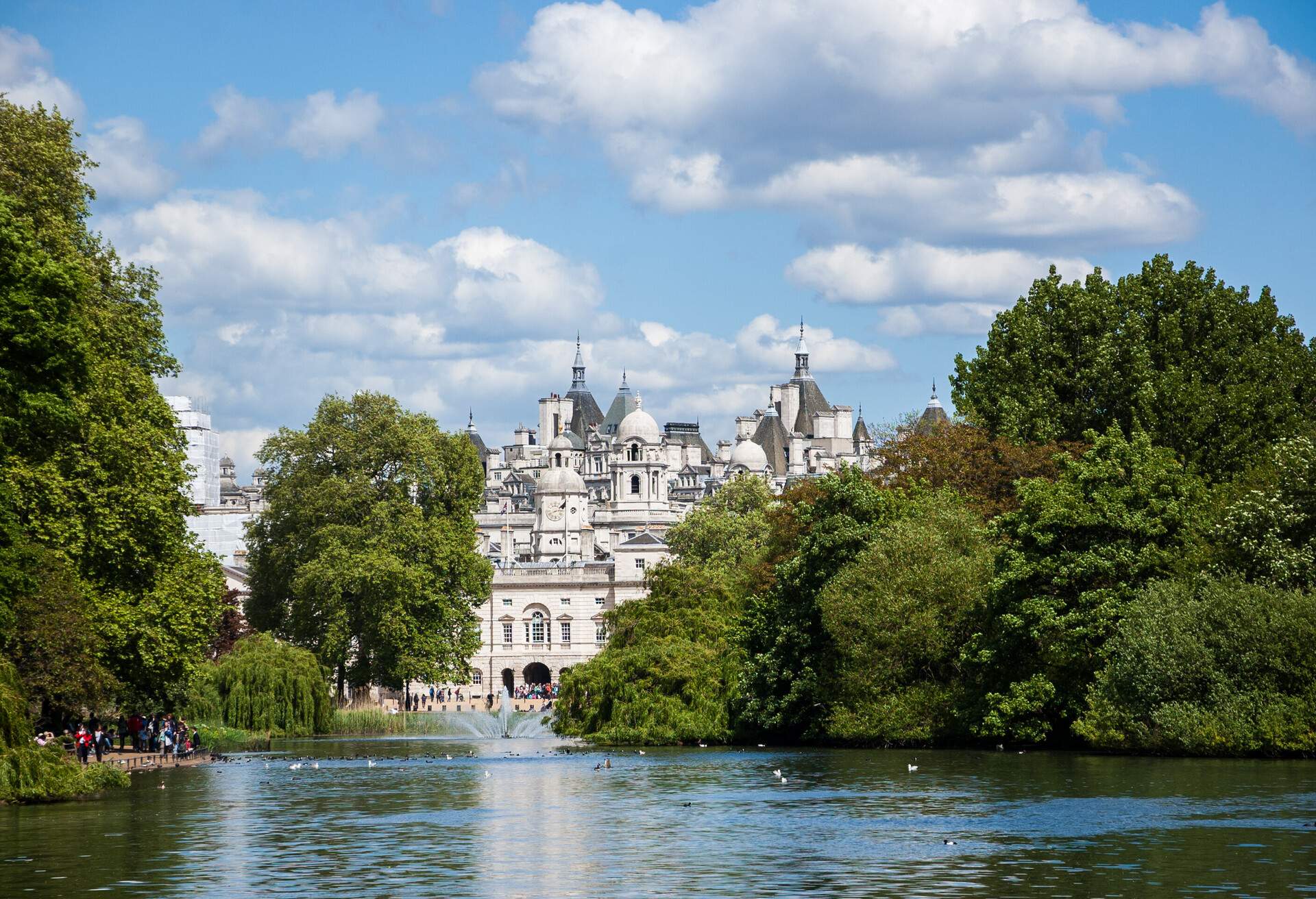 A cityscape view through the Serpentine lake in Hyde Park, Kensington Gardens in sunny day. London UK.; Shutterstock ID 192827669; Purchase Order: SF-06928905; Job: ; Client/Licensee: ; Other: