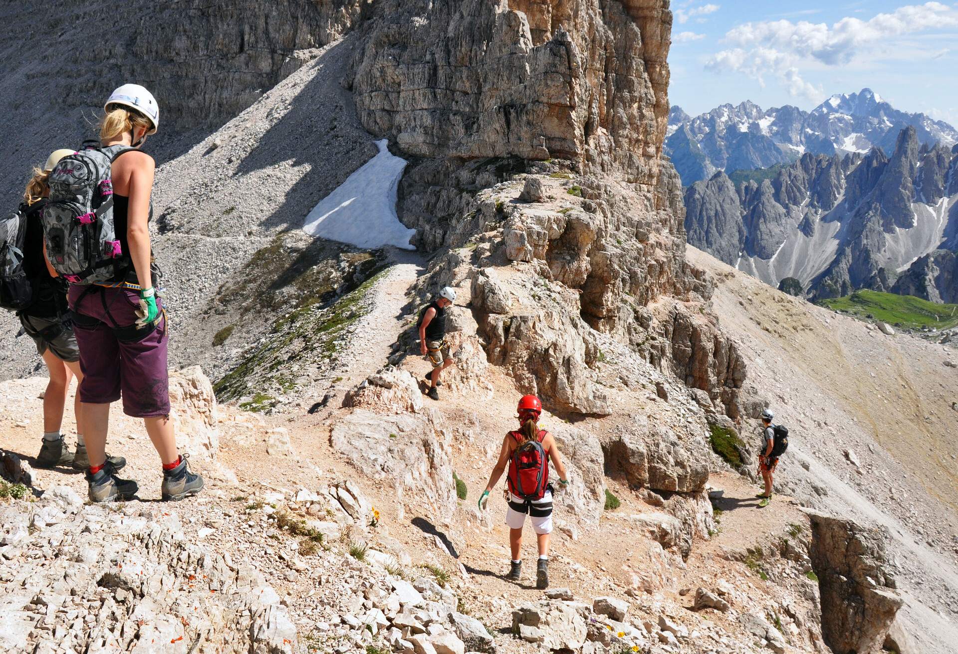 Hikers and climbers walking in Dolomites, Alps, Italy; Shutterstock ID 335151152; Purpose: ; Brand (KAYAK, Momondo, Any):