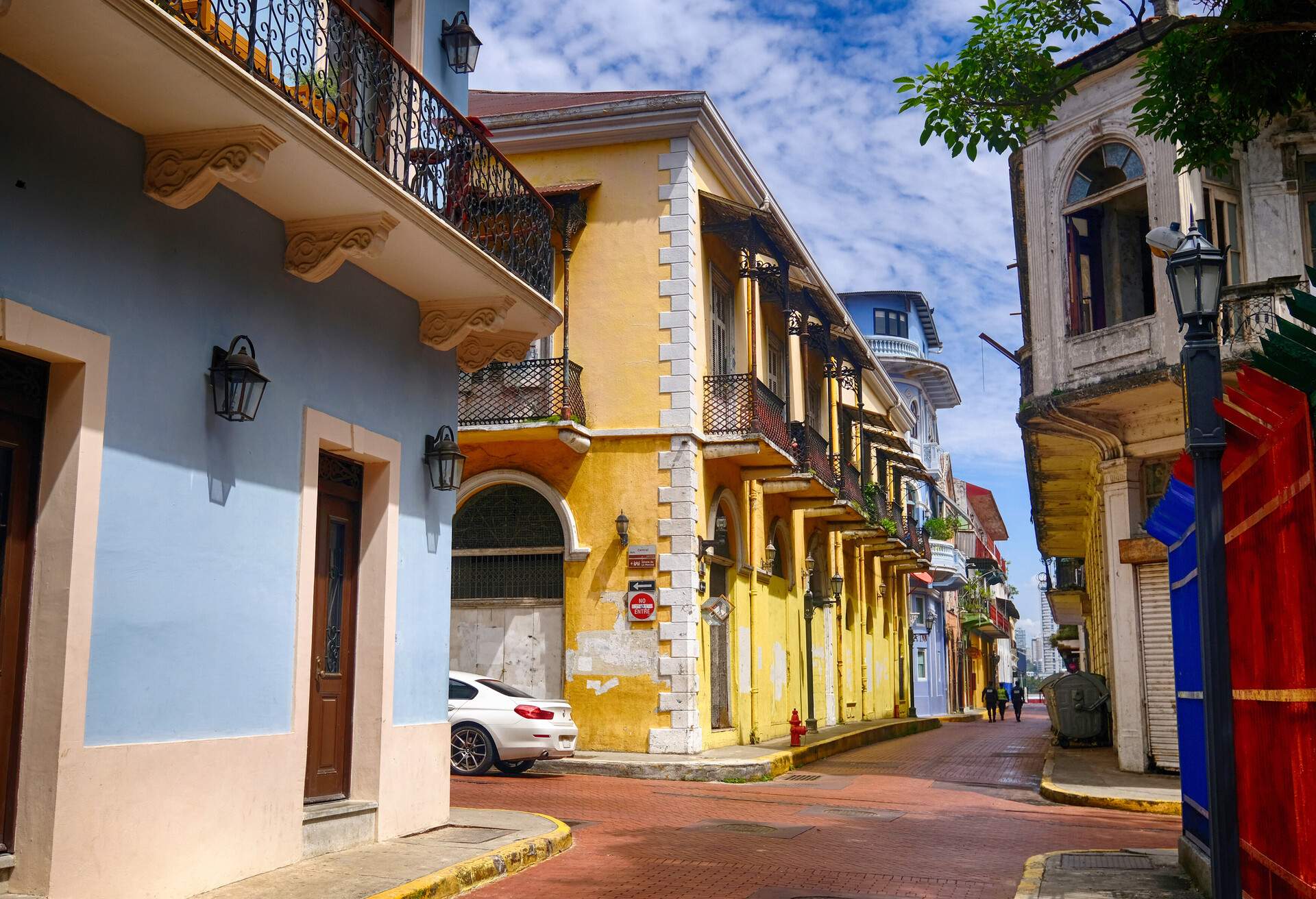 The less crowded streets of an old town surrounded by colourful buildings.