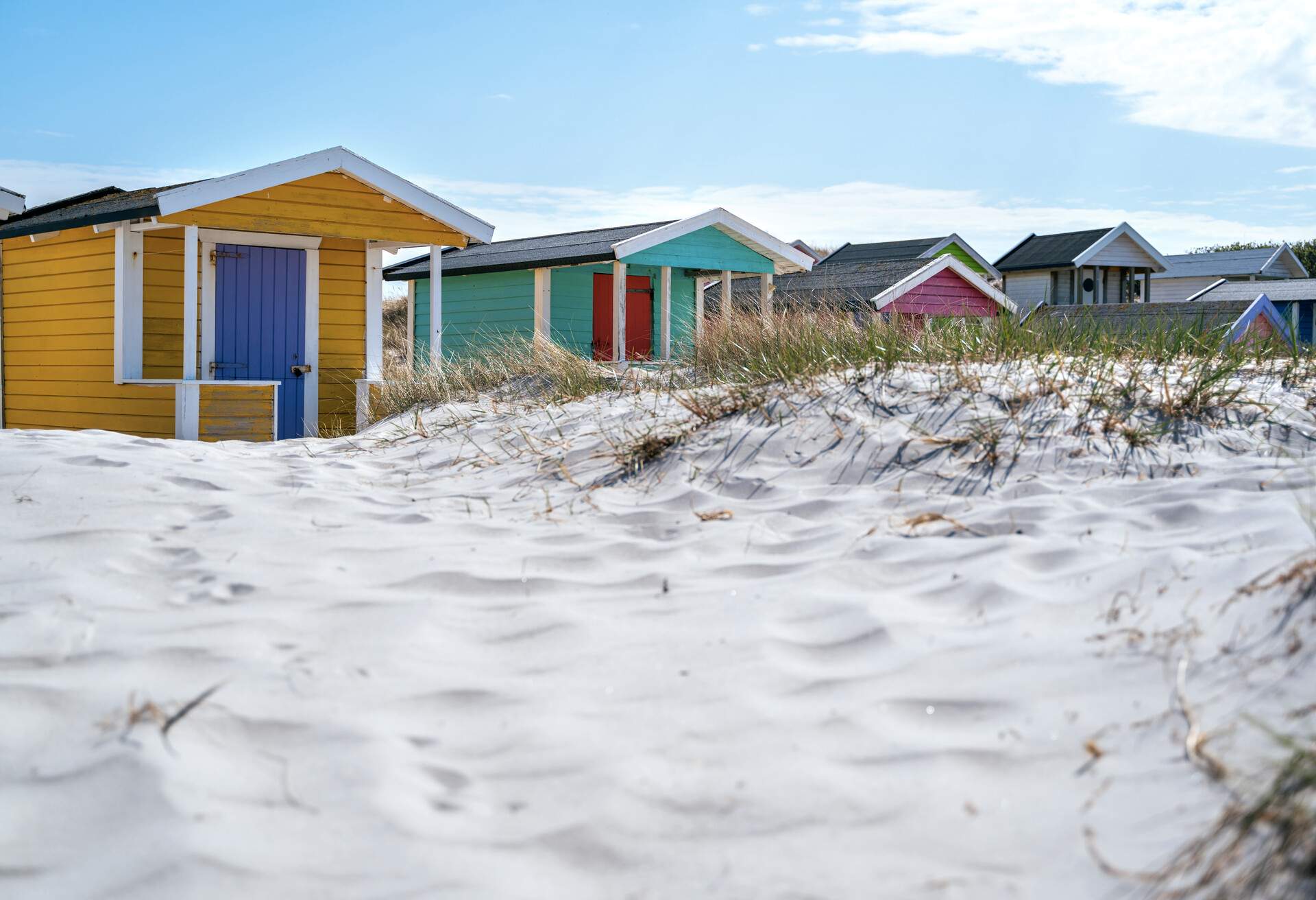Beach huts or bath cottages on Skanor beach dunes and Falsterbo in South Sweden, Skane travel destination. Domestic tourism concept