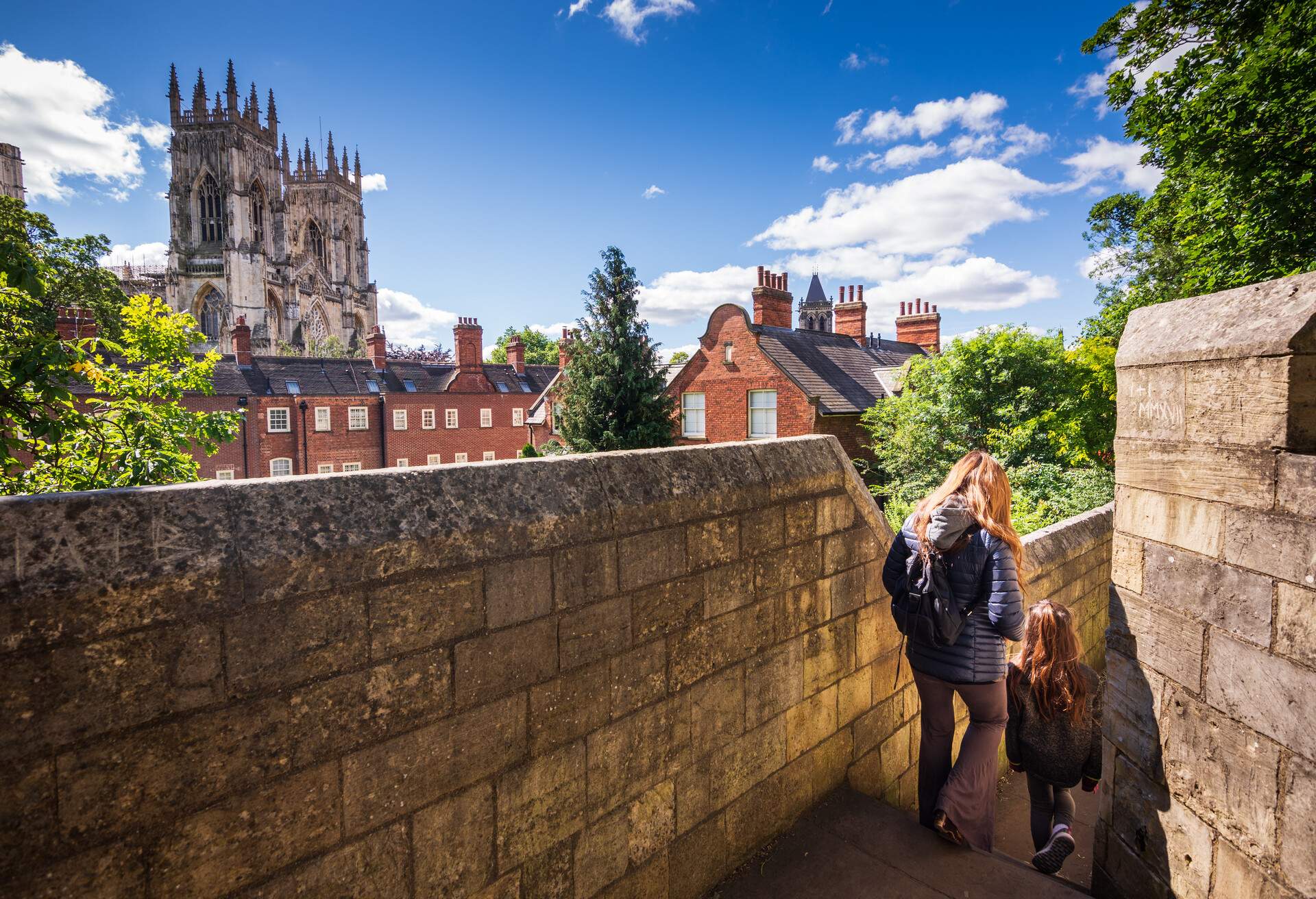 DEST_UK-ENGLAND_YORK_THEME_PEOPLE_MOTHER_AND_DAUGHTER_ALONG_CITY-WALLS_GettyImages-1026947736