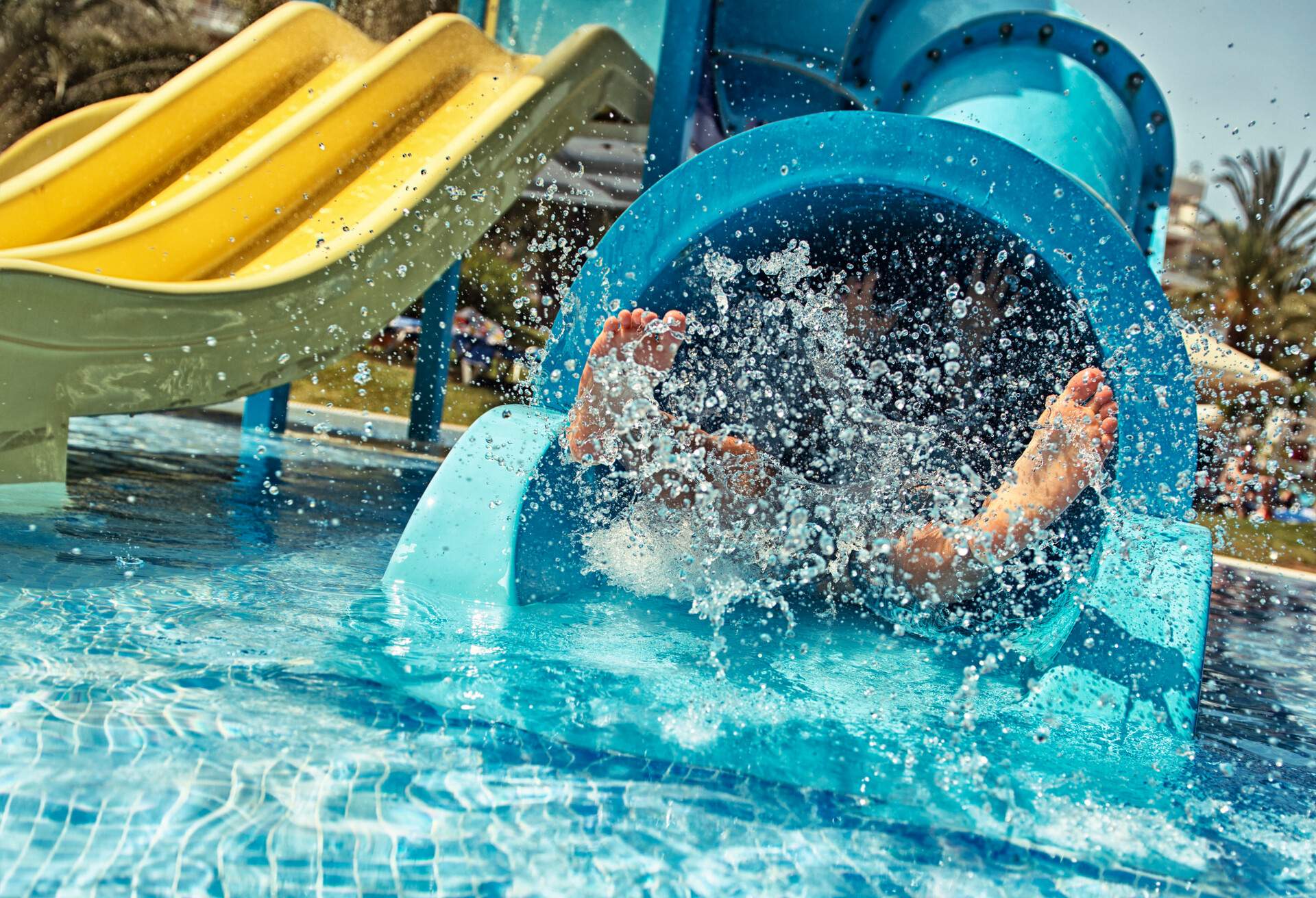 Little girl in water park. Actually little feet in waterpark.