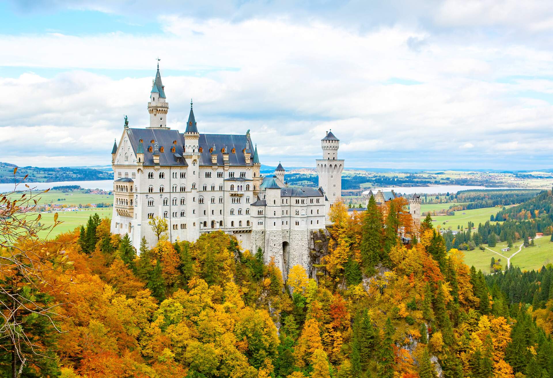 Neuschwanstein Castle, Germany. View of the tourist attraction surrounded by autumn colors during fall