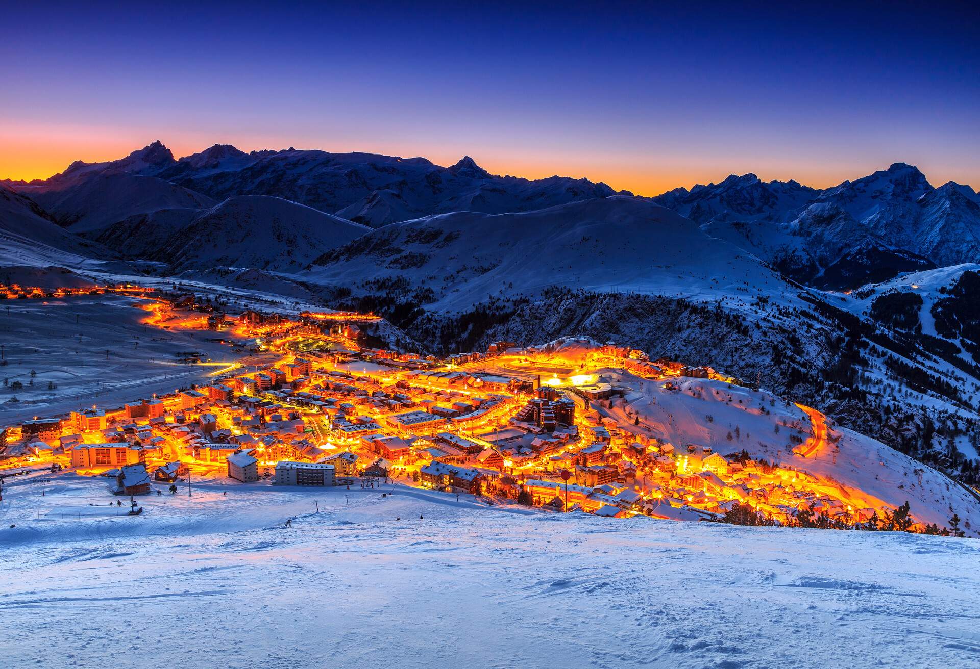 Stunning winter sunrise landscape and ski resort in French Alps,Alpe D Huez,France,Europe