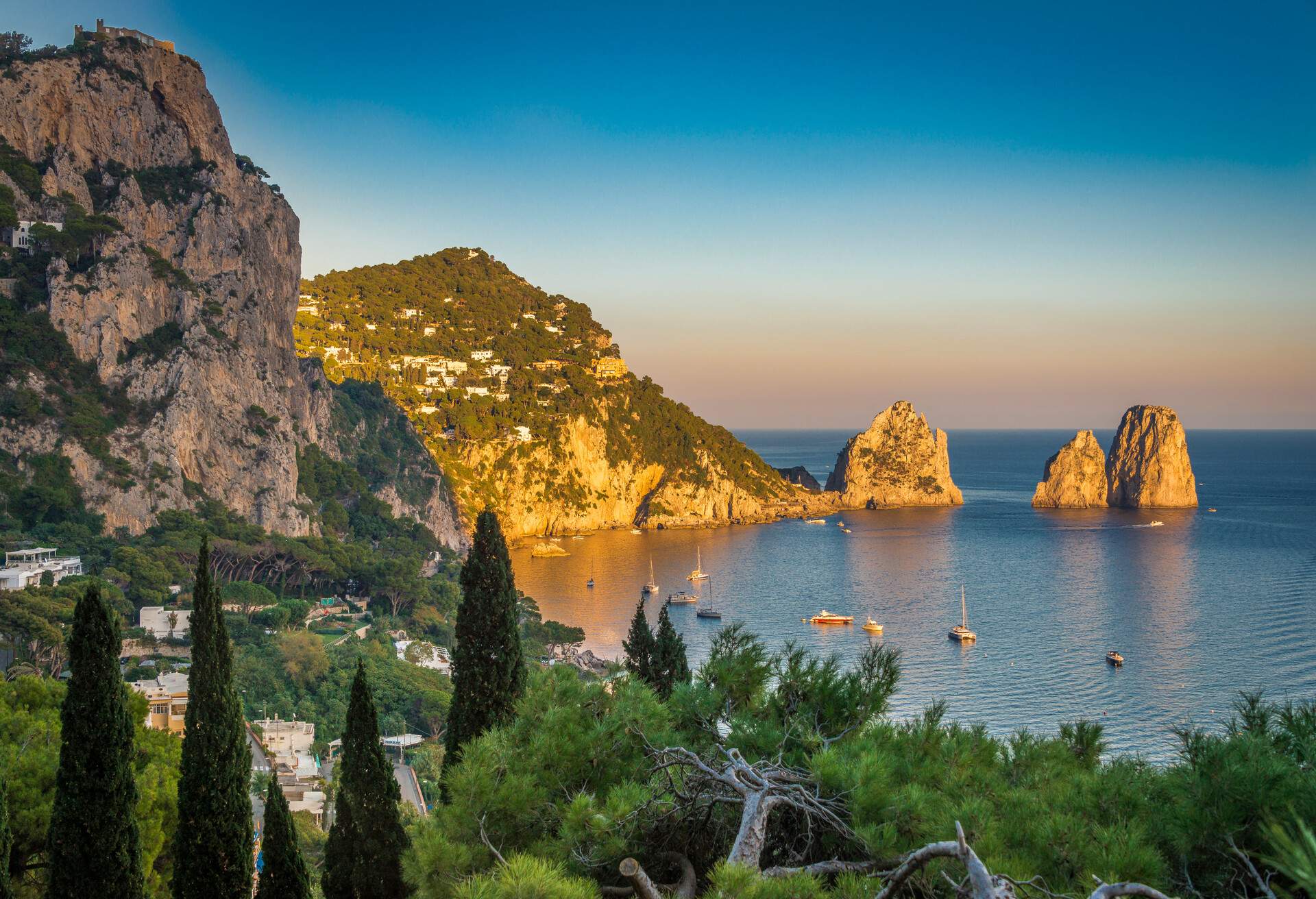 Capri, Italy - October 15, 2017: the three famous faraglioni in the Bay of Naples, off the island of Capri.