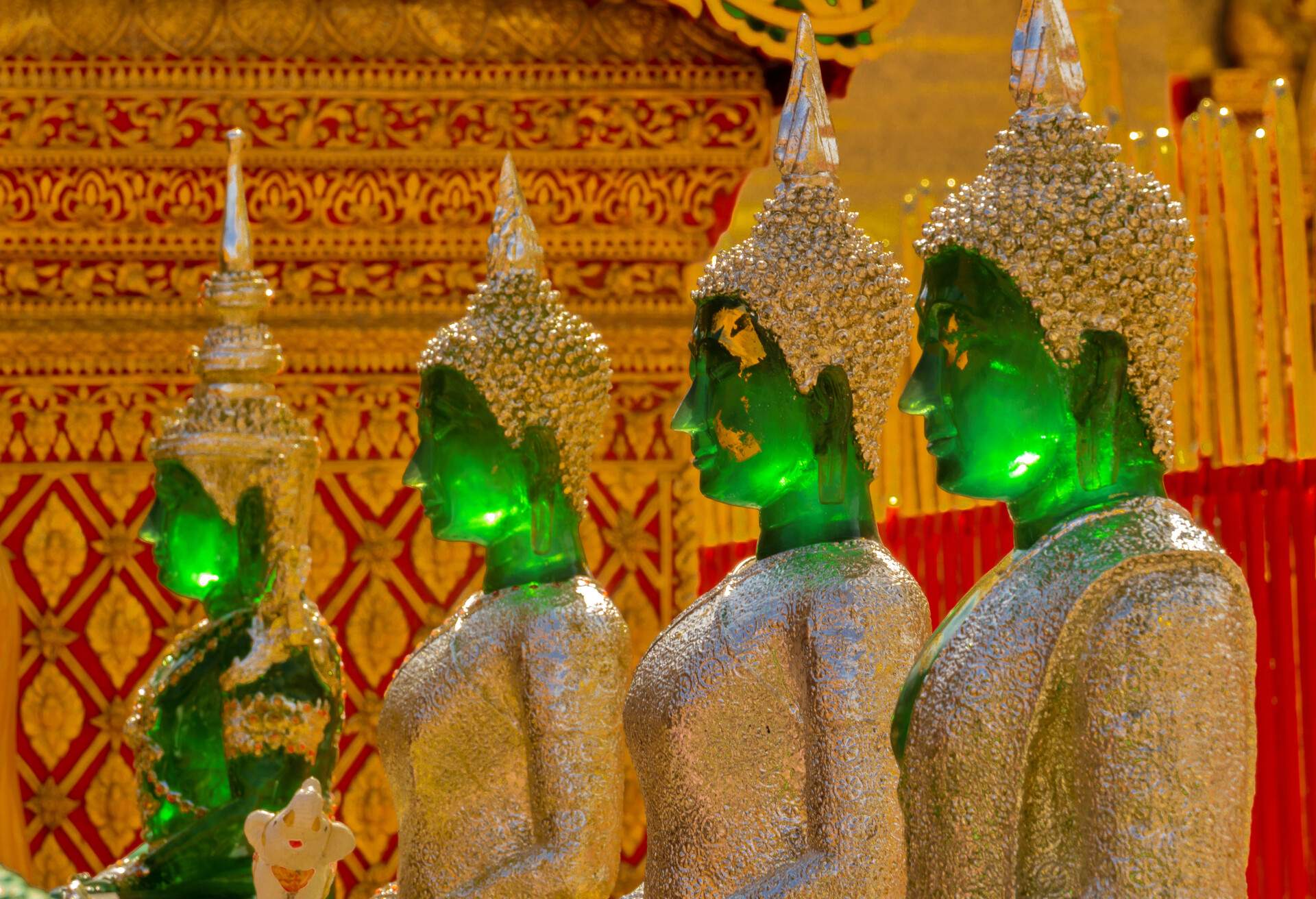 selective focused image of tidily ancient green buddha statues in temple at Wat Phra That Doi Suthep temple in Chiang Mai, Thailand