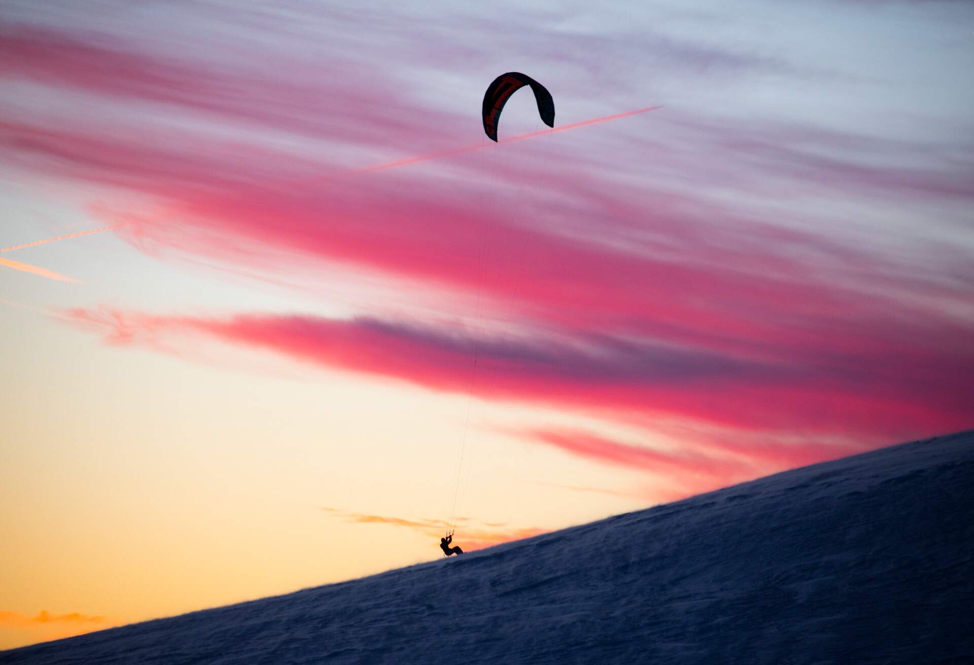 THEME_PEOPLE_SNOW_KITE_SUNSET_GettyImages