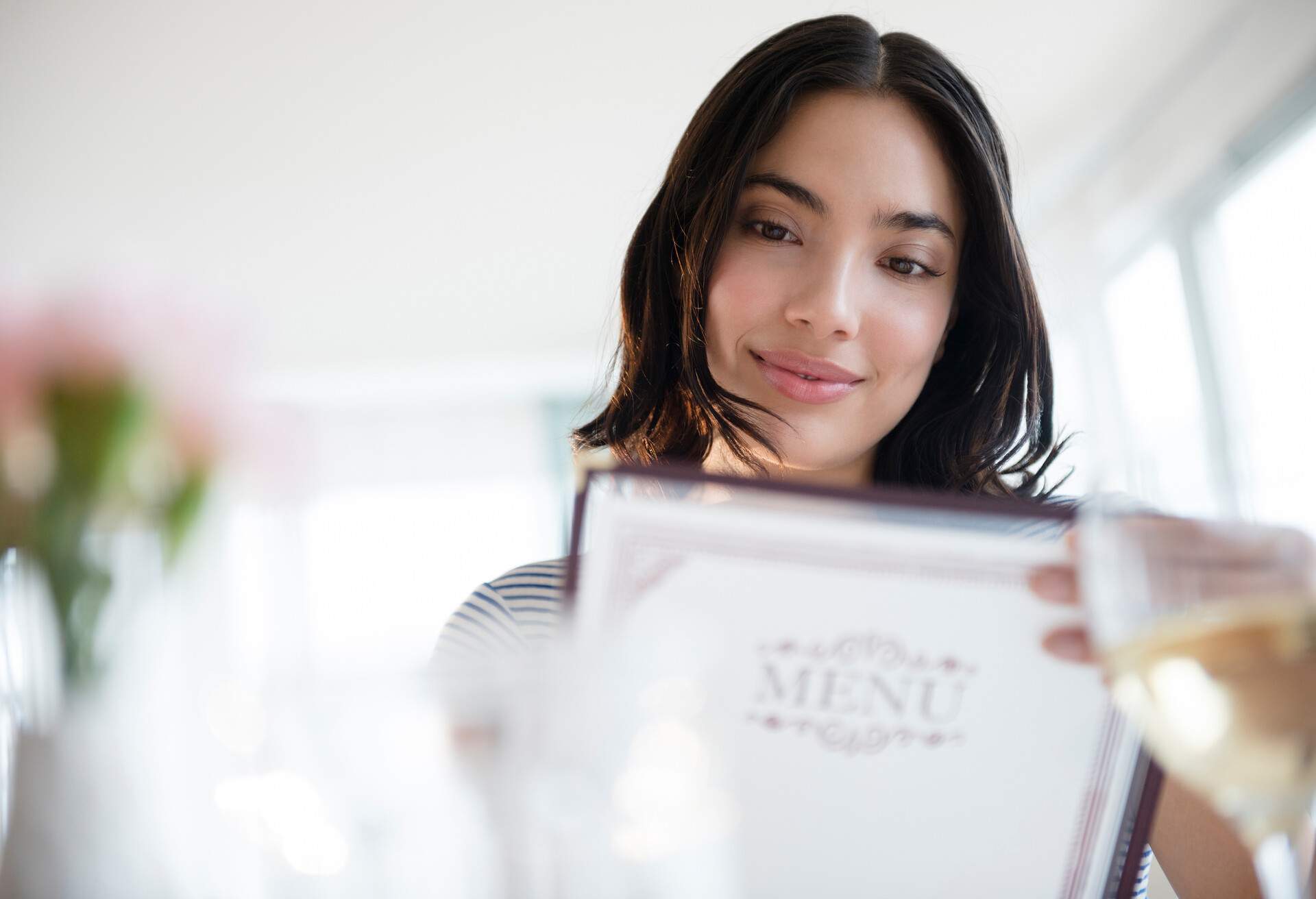 THEME_PEOPLE_WOMAN_RESTAURANT_MENU_GettyImages