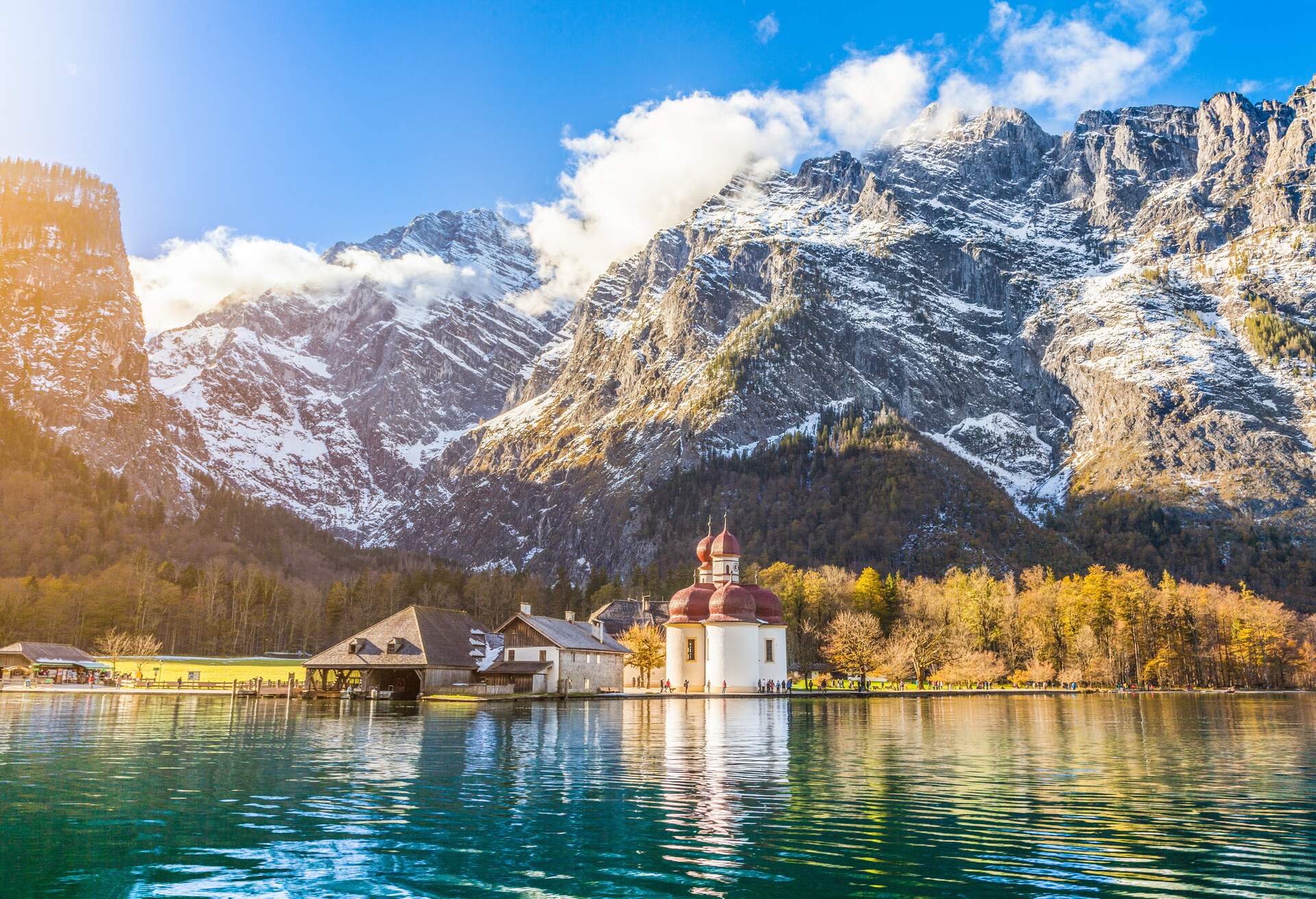 Panoramic view of scenic mountain scenery with Lake Konigssee with world famous Sankt Bartholomae (St. Bartholomew) pilgrimage church in fall, Nationalpark Berchtesgadener Land, Bavaria, Germany.