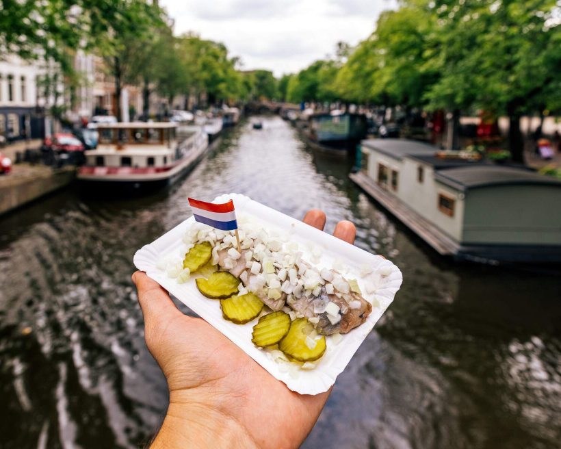 DEST_NETHERLAND_AMSTERDAM_CANAL_THEME_FOOD_DUTCH_HERRING_HOLLANDSE_NIEUWE_GettyImages