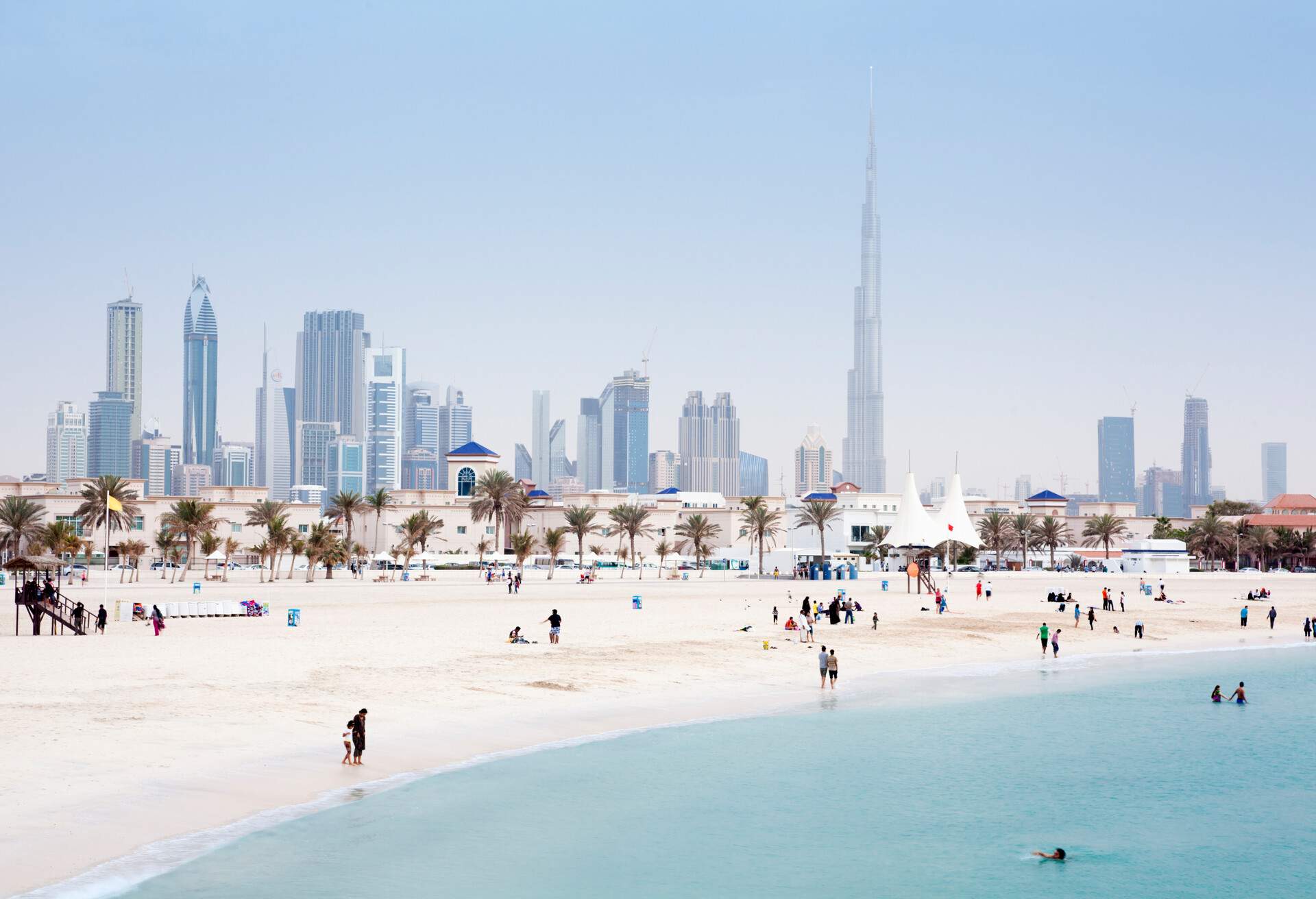 The crowded Jumeirah Beach backed by Dubai's distinctive architecture.