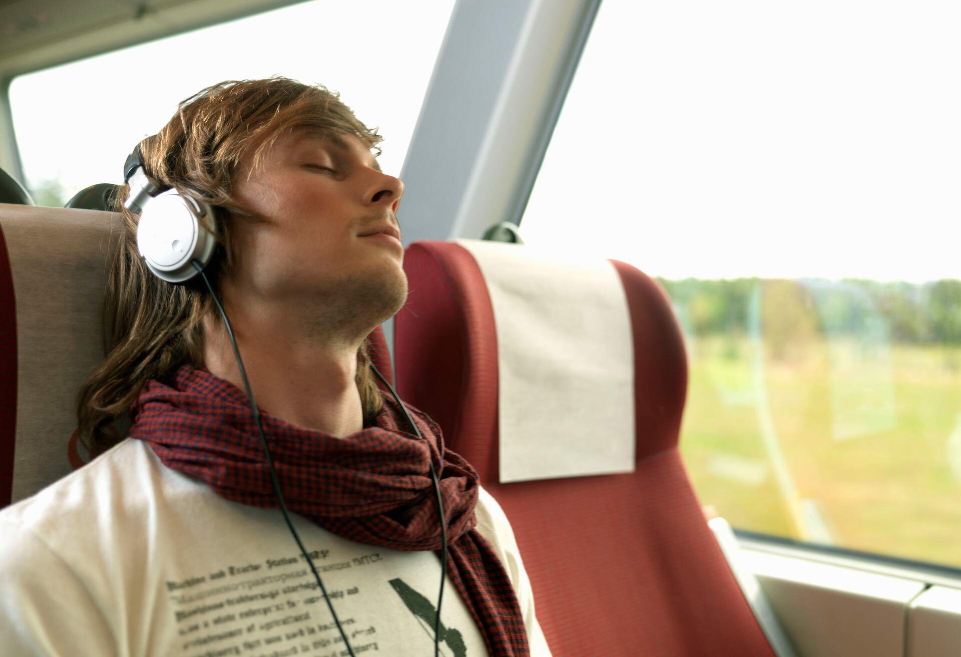 THEME_TRAIN_TRAVEL_PEOPLE_MAN_WITH_HEADPHONES_GettyImages-83779271