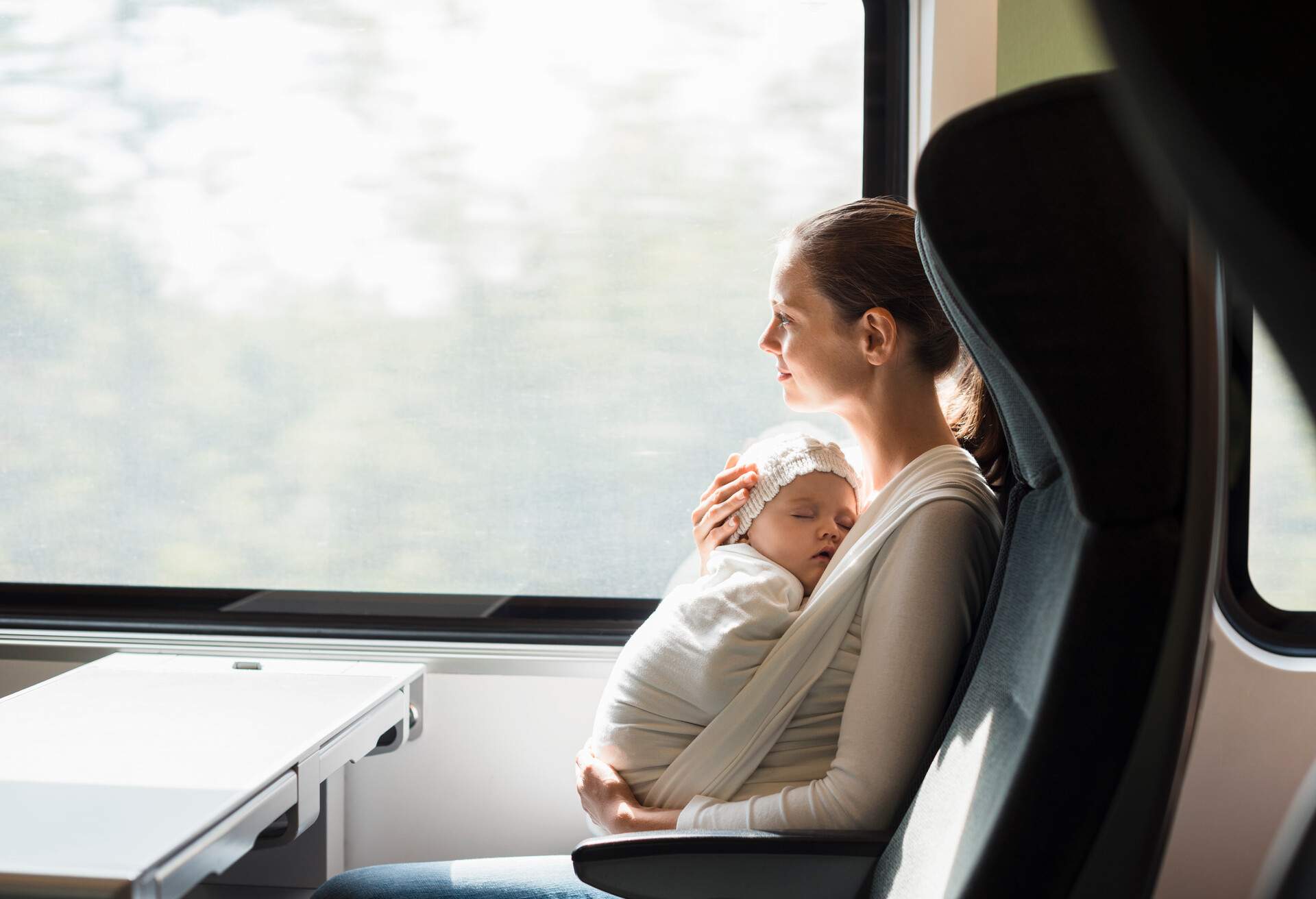 THEME_TRAIN_WOMAN_BABY_GettyImages-900243824