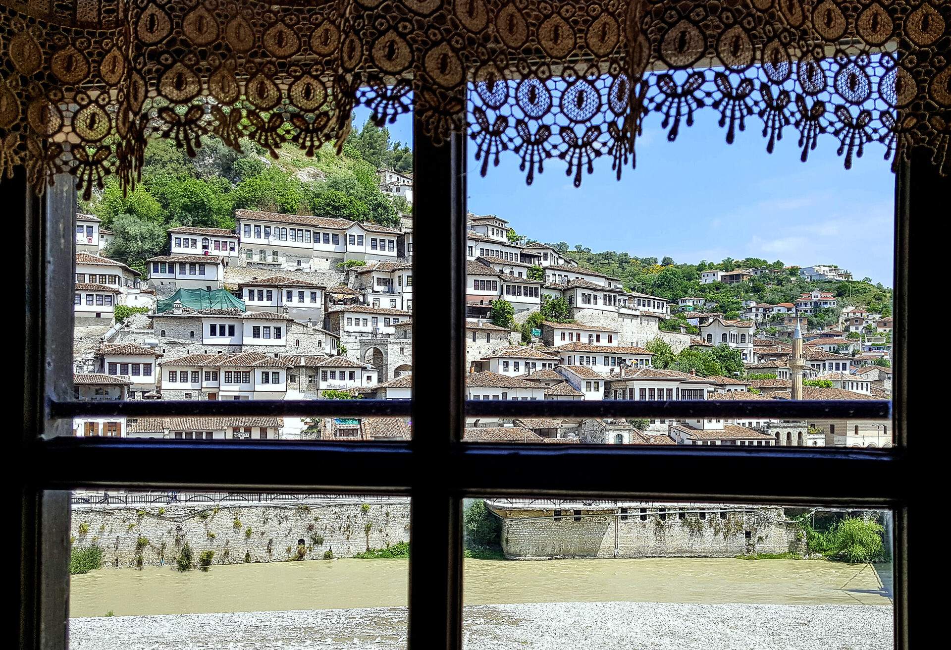 Ottoman houses of Berat, across the Osum River. View on Mangalem district, taken from a house at the other side of the river, from Gorica. In 2008, the old town of Berat was added to the Unesco world heritage list.