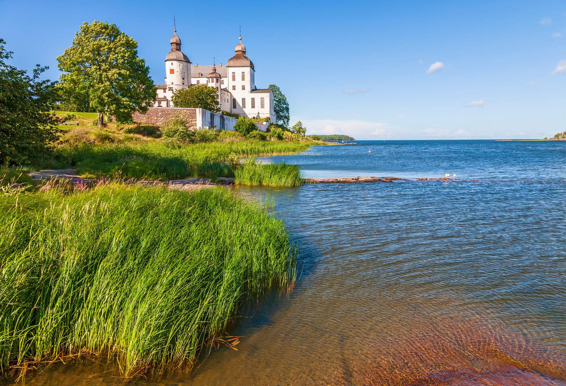 Lacko castle in Sweden at a shoreline a beautiful summer day