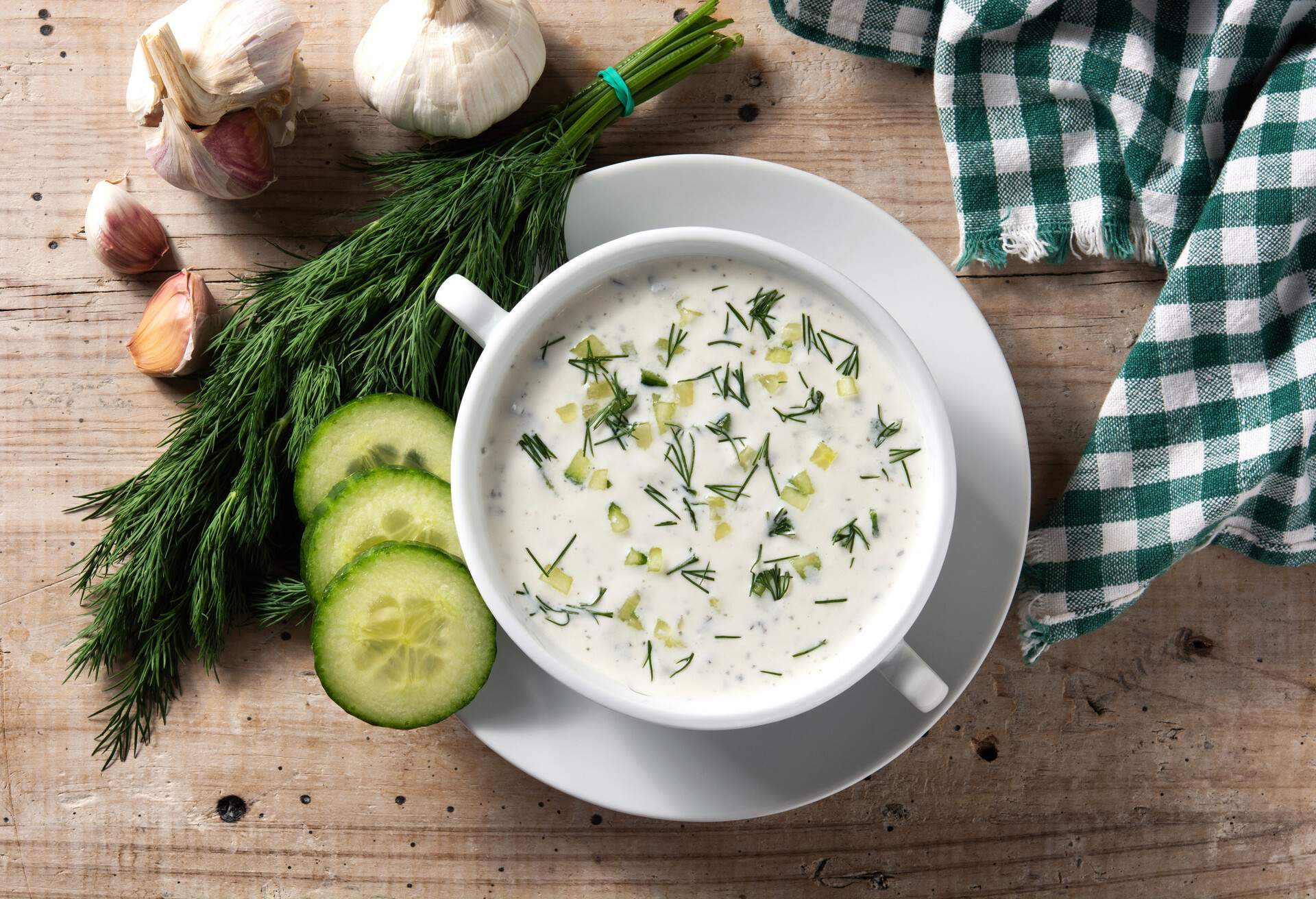 Bulgarian tarator sour milk soup on wooden table