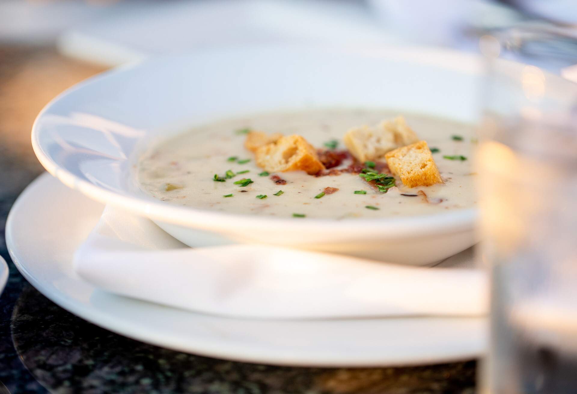 High end Restaurant Food Clam Chowder Patio Late evening Sunlight