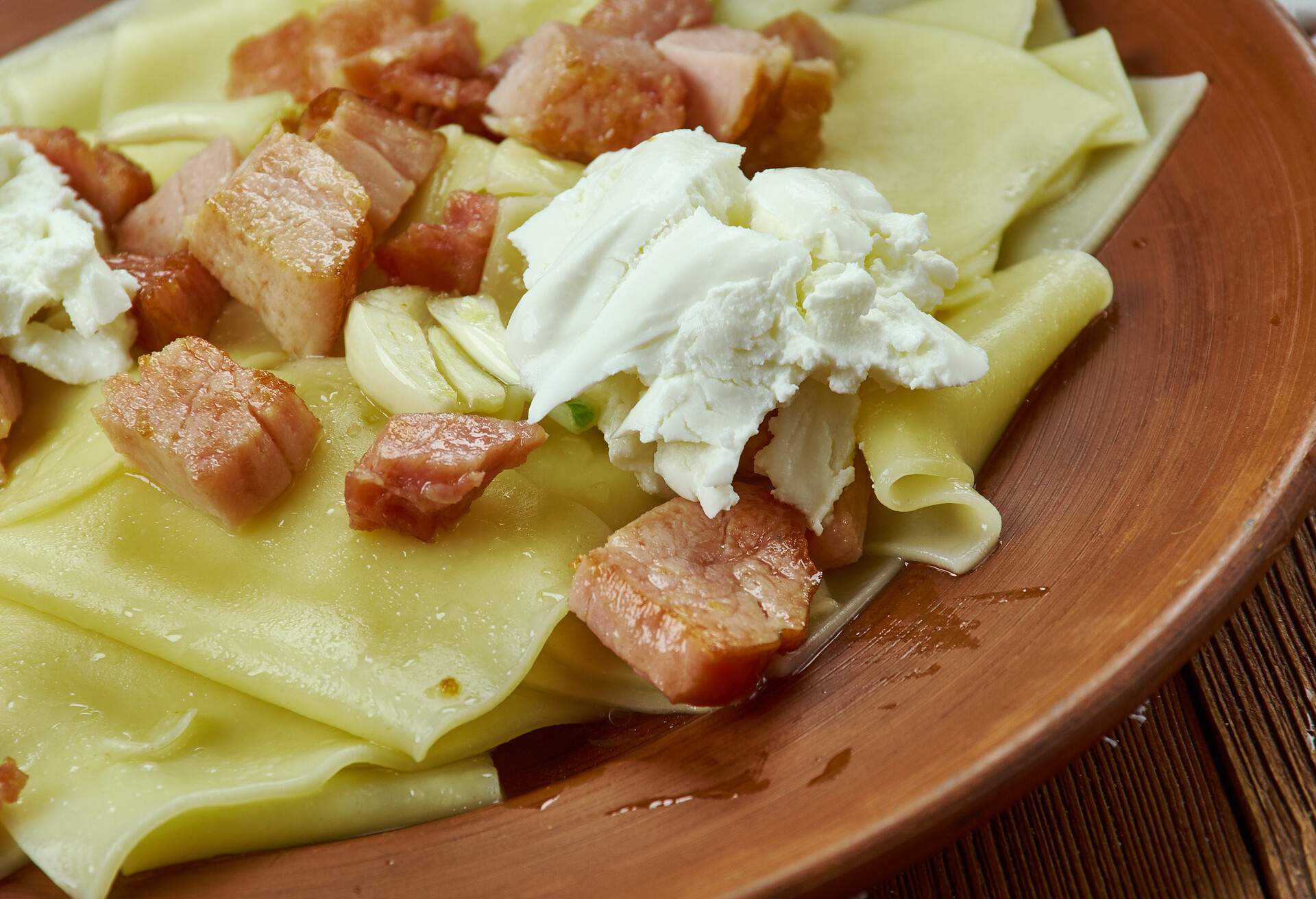 Lazanki -  Belarusian and Polish pasta dishes,  with melted pork fat  and sour cream.