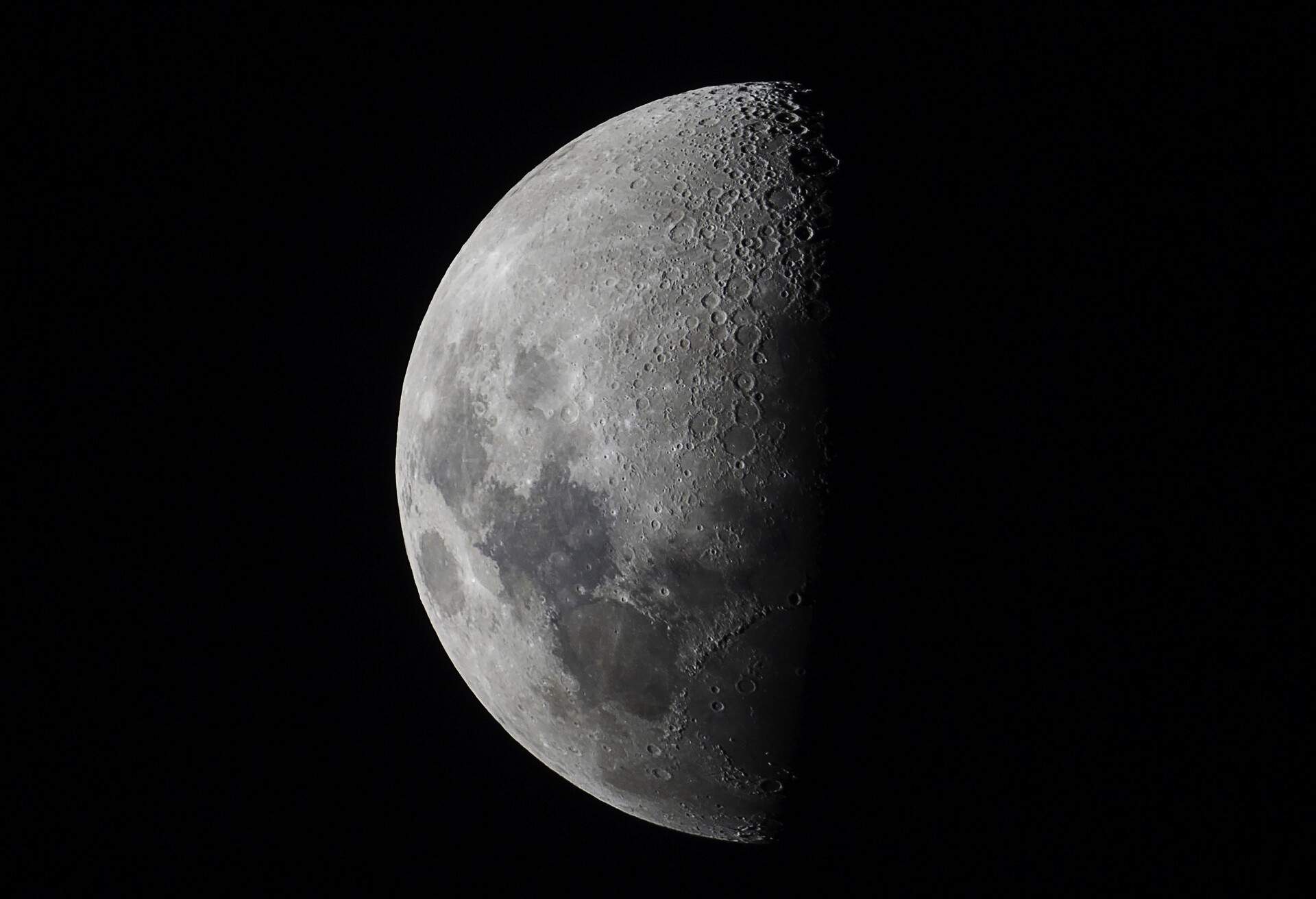 Visible craters on the moon.