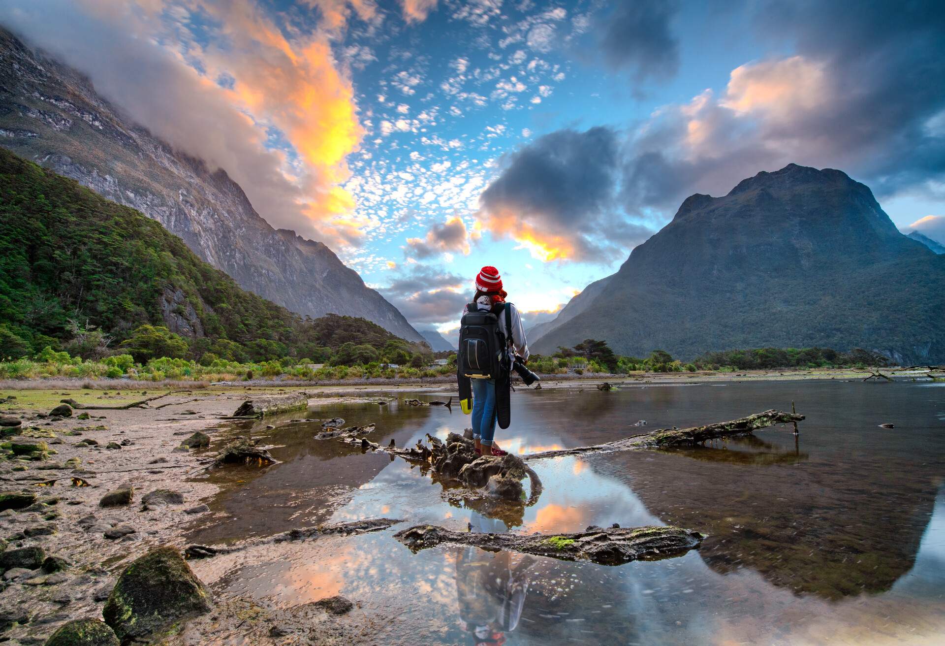 DEST-NEW-ZEALAND_MILFORD-SOUND_THEME_PEOPLE_HIKER_ON_A_NATIONAL-PARK_GettyImages-1059505718