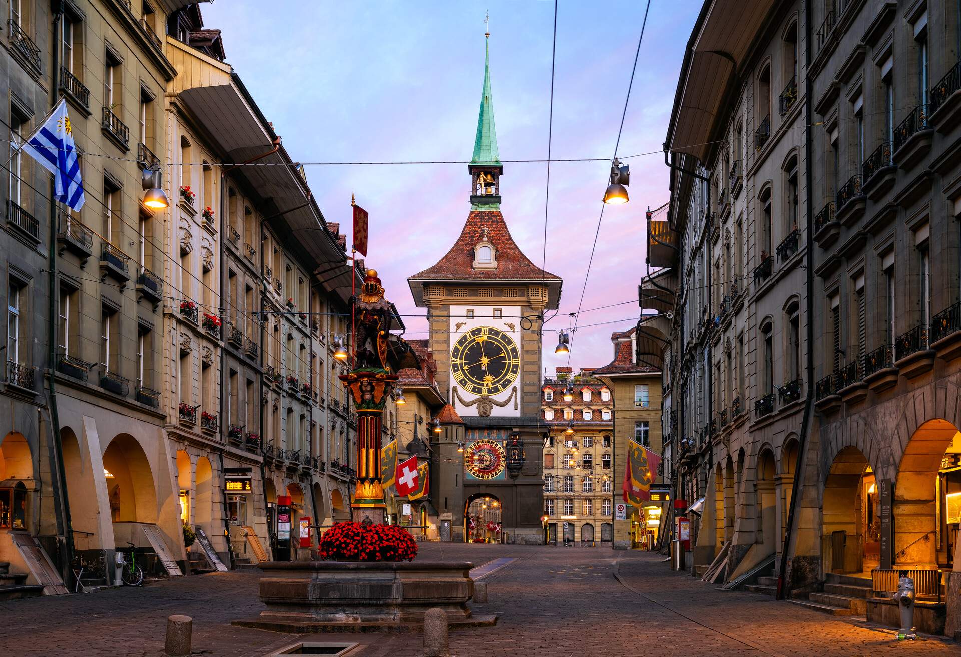 The famous Zytglogge, Astronomical Clock in Altstadt (Old Town) of Bern, the capital of Switzerland. This photograph was taken at sunrise along Kramgrasse Street