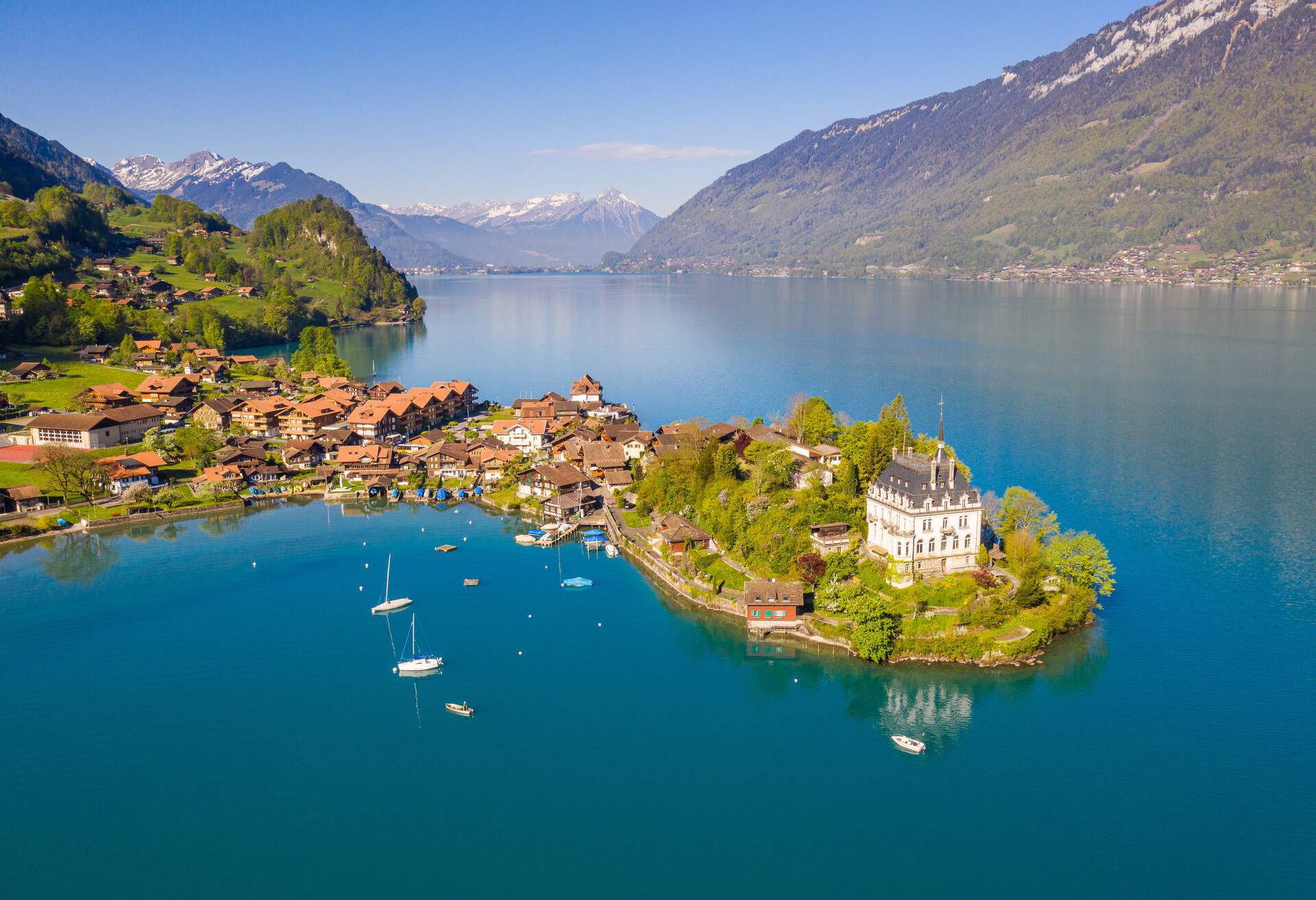 Idyllic view of the Iseltwald village by lake Brienz on a sunny morning in Canton Bern in Switzerland