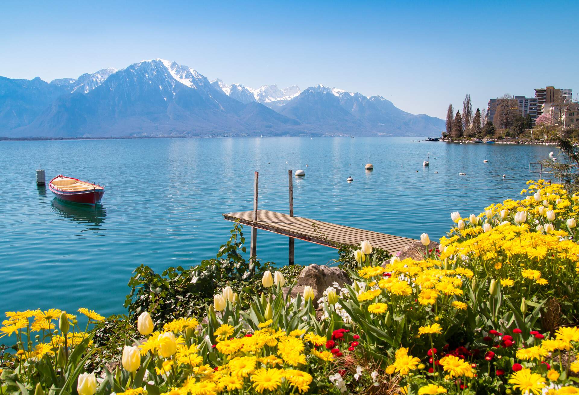 Flowers, mountains and jetty on Lake Geneva, Montreux, Switzerland