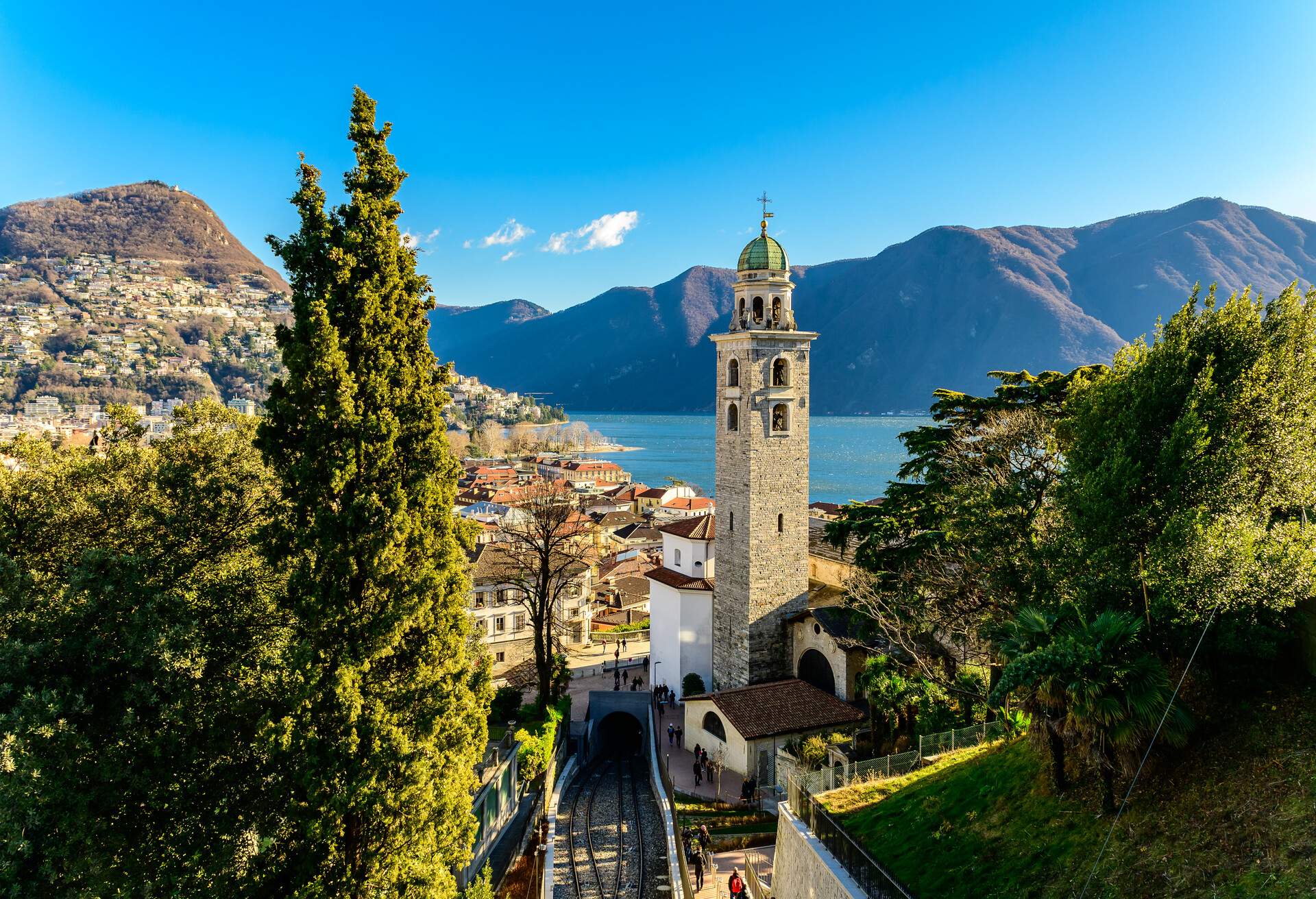 View over the city of Lugano in Switzerland on a sunny winter day. The style of a lot of buildings and churches in Lugano has italian influence due the proximity of the italian border.