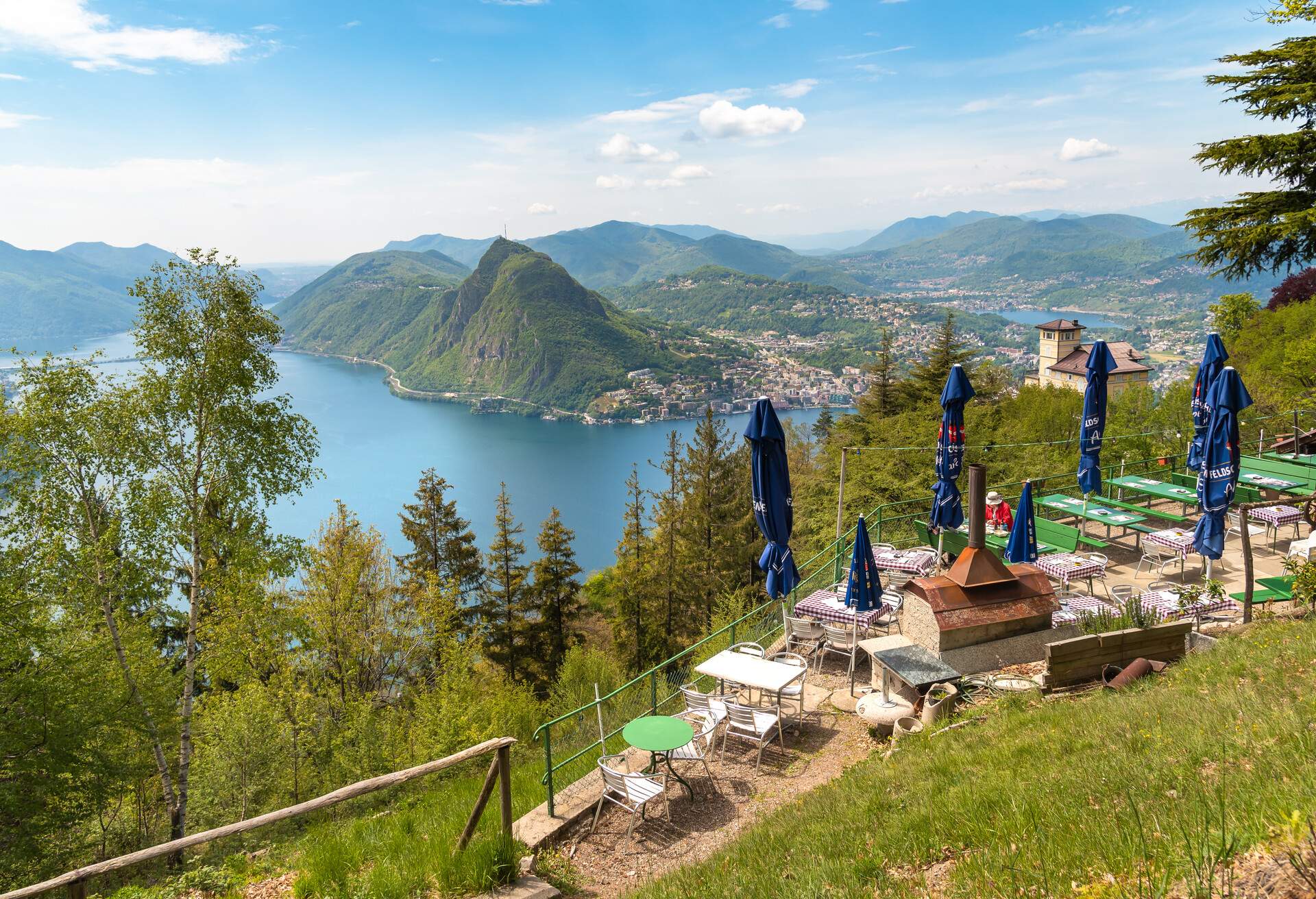 Monte Bre, Lugano, Switzerland - May 7, 2019: View of lake Lugano with Monte San Salvatore from a restaurant in Monte Bre, Switzerland