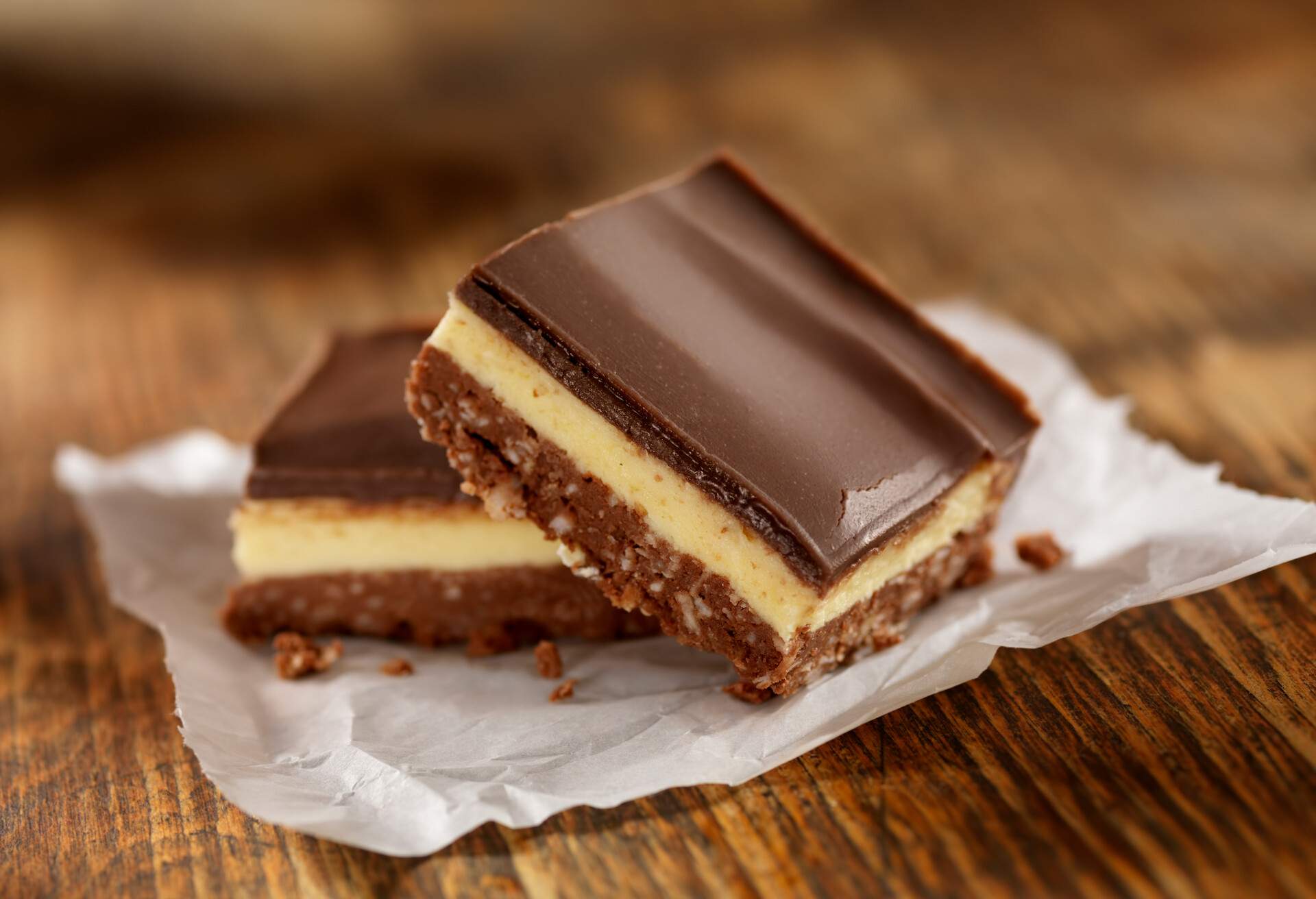 Nanaimo Bars have a crumb and coconut base layer, topped with vanilla custard flavoured butter icing and covered in chocolate -Photographed on Hasselblad H3D2-39mb Camera