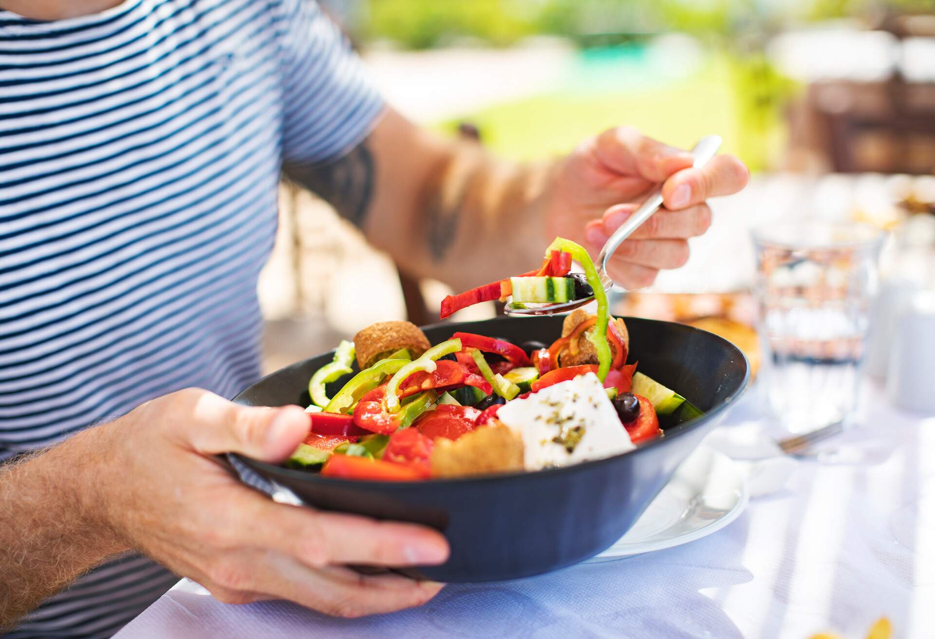 Men eating Greek Salad