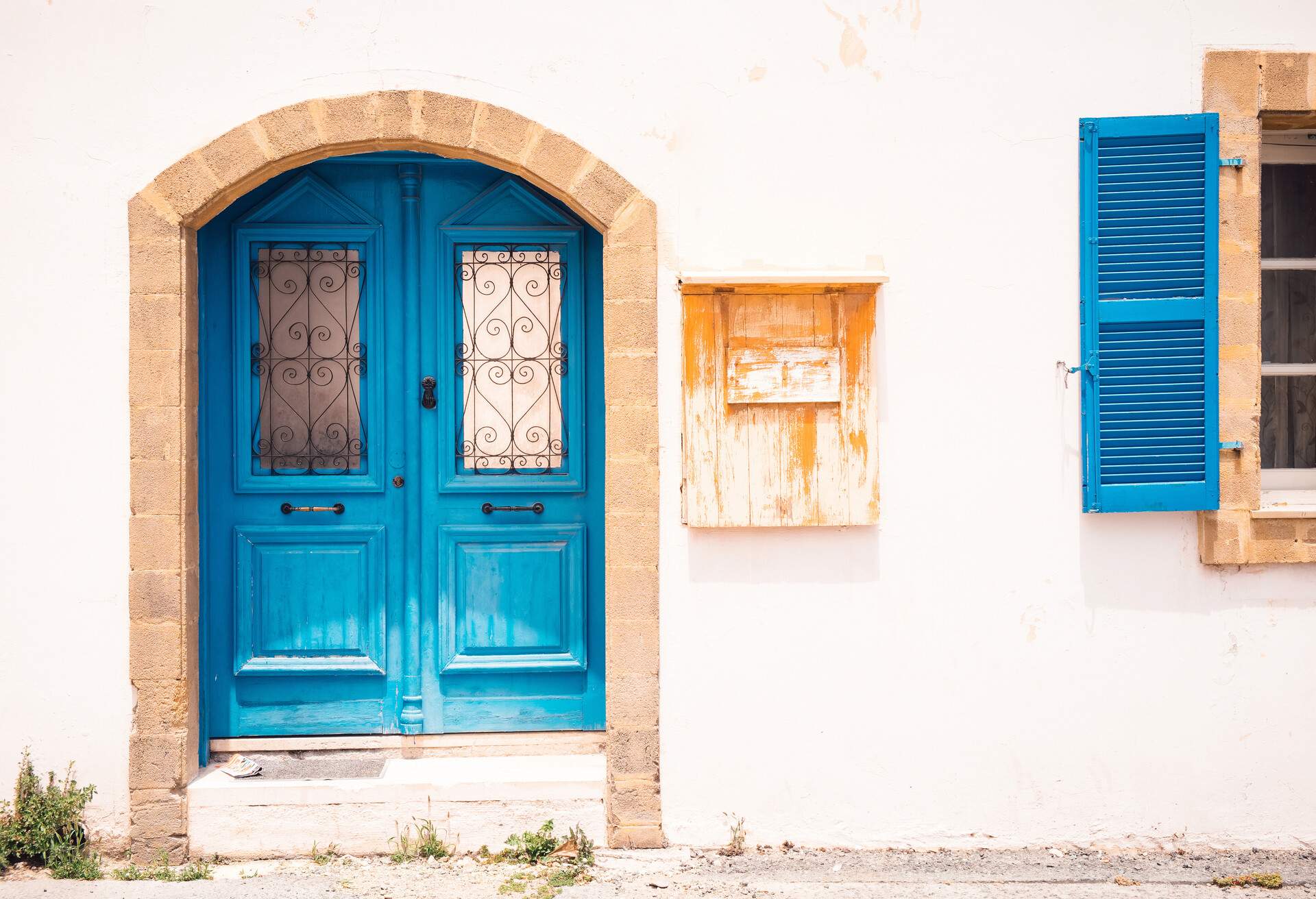 Blue door and colorful building. Old city architecture in Paphos, Cyprus