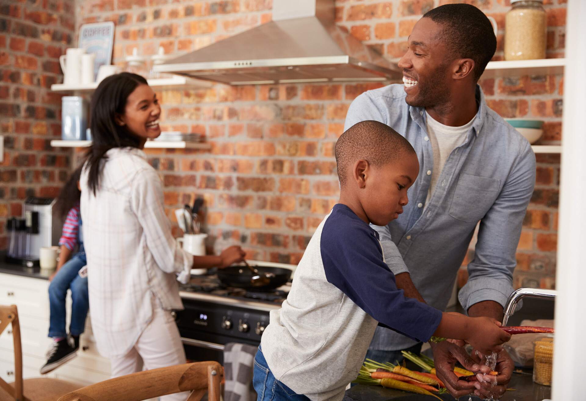Children Helping Parents To Prepare Meal In Kitchen; Shutterstock ID 627670217